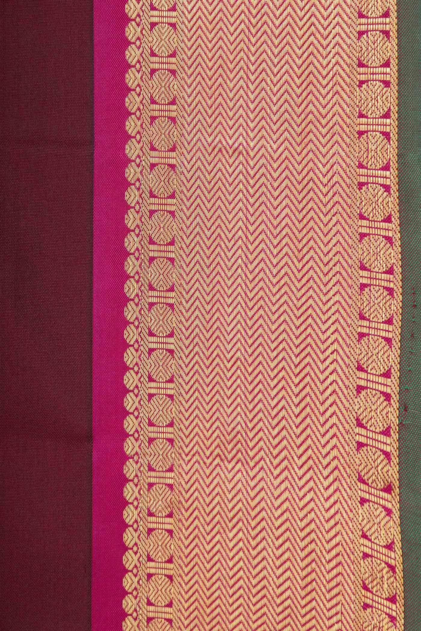 Border image of Maroon Dual Tone Kanchipuram Silk Saree with Zari Butta on the body and Zari Border