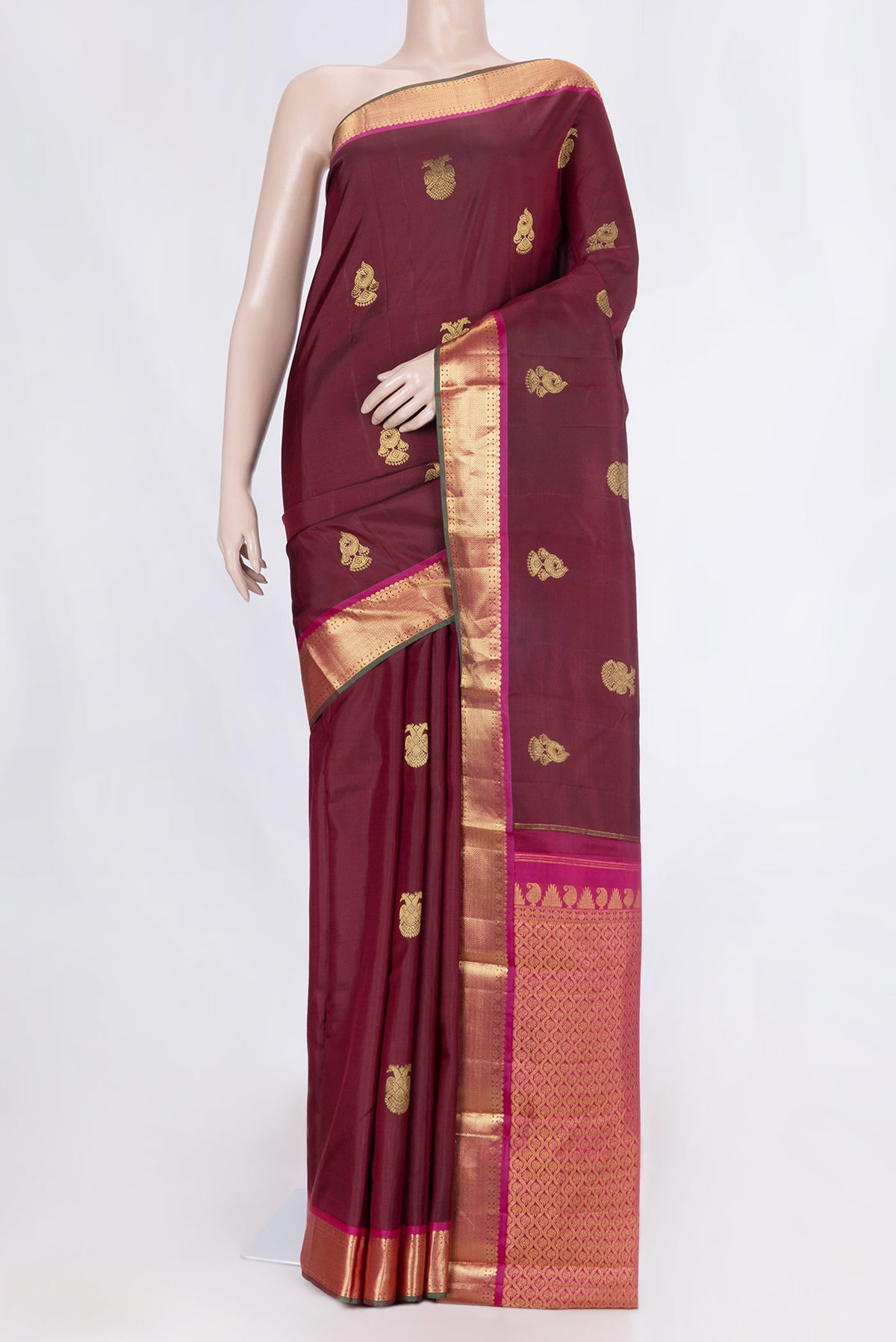 Maroon Dual Tone Kanchipuram Silk Saree with Zari Butta on the body and Zari Border displayed on a mannequin