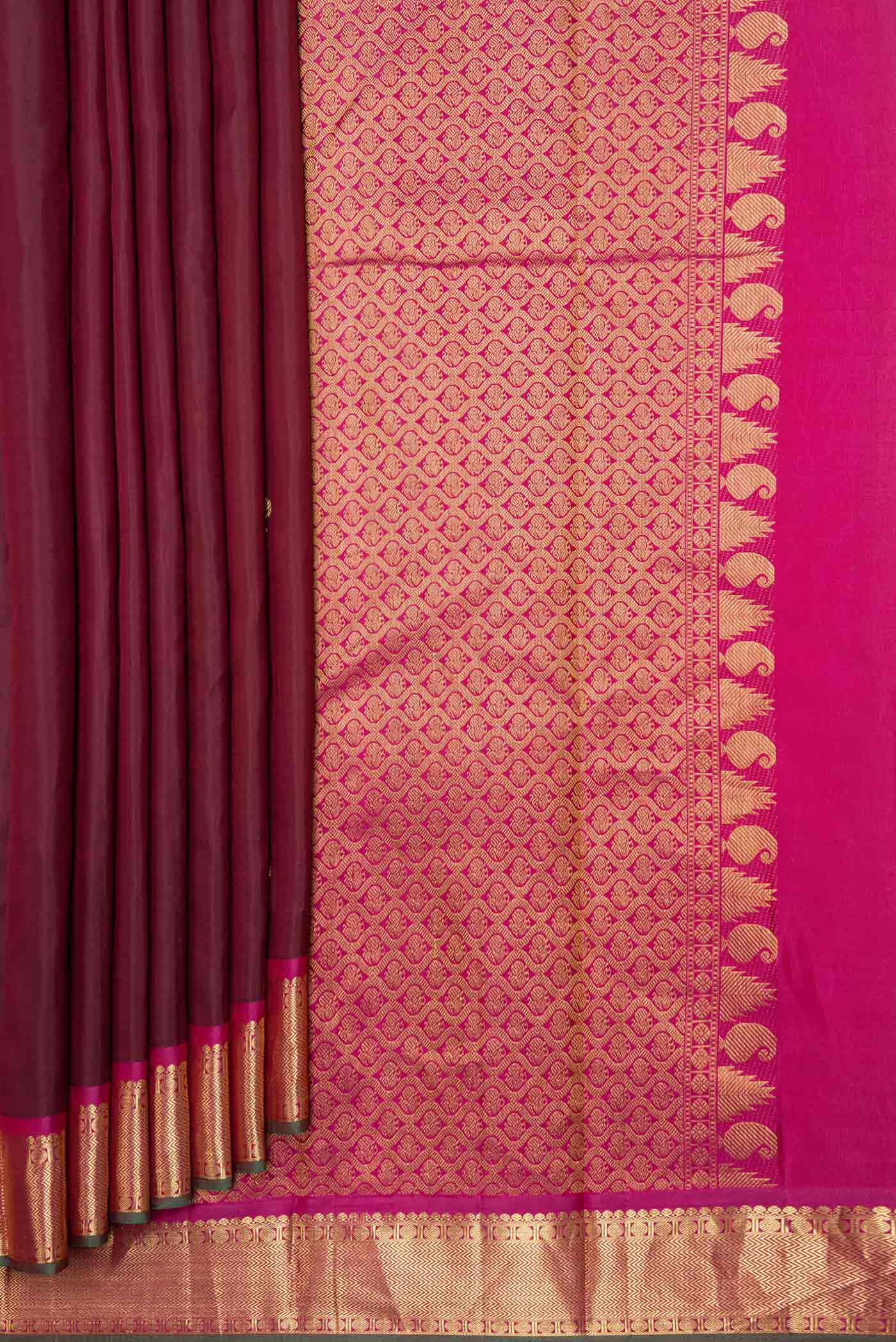 Pleats and pallu of Maroon Dual Tone Kanchipuram Silk Saree with Zari Butta on the body and Zari Border