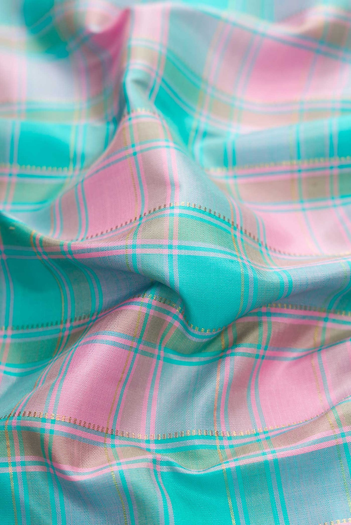Close up of Pure Silk Pure Zari Sky Blue, Pink and Grey Color Kanchipuram Saree with Checked design on the body and Zari Border displaying folds