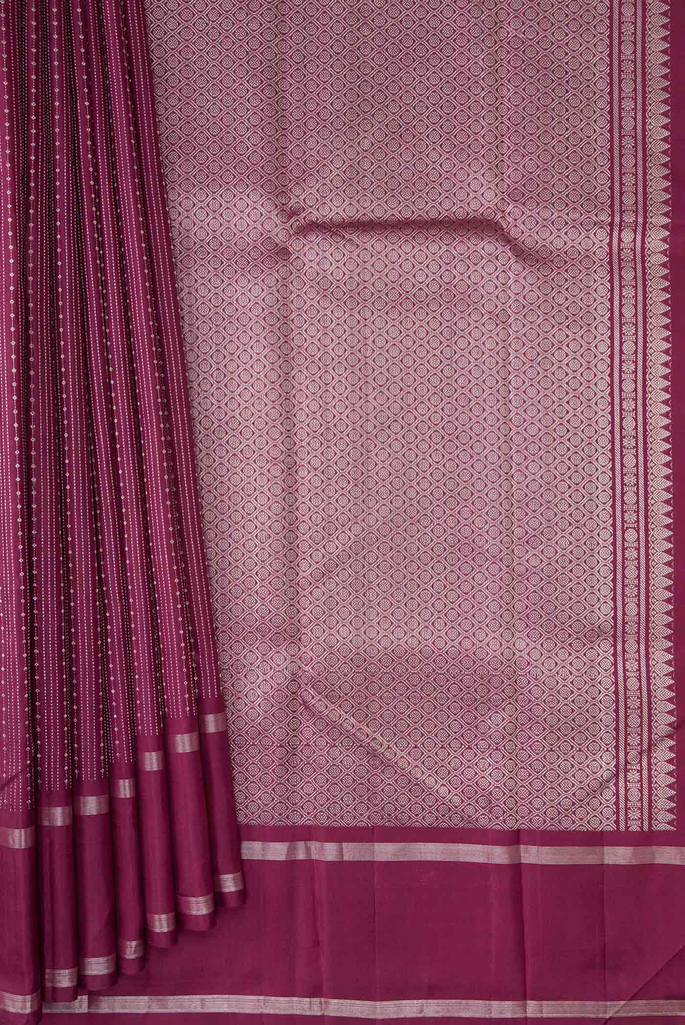 Pleats and pallu of Maroon Dual Tone Kanchipuram Silk Saree with Stripes on the body and Zari Border