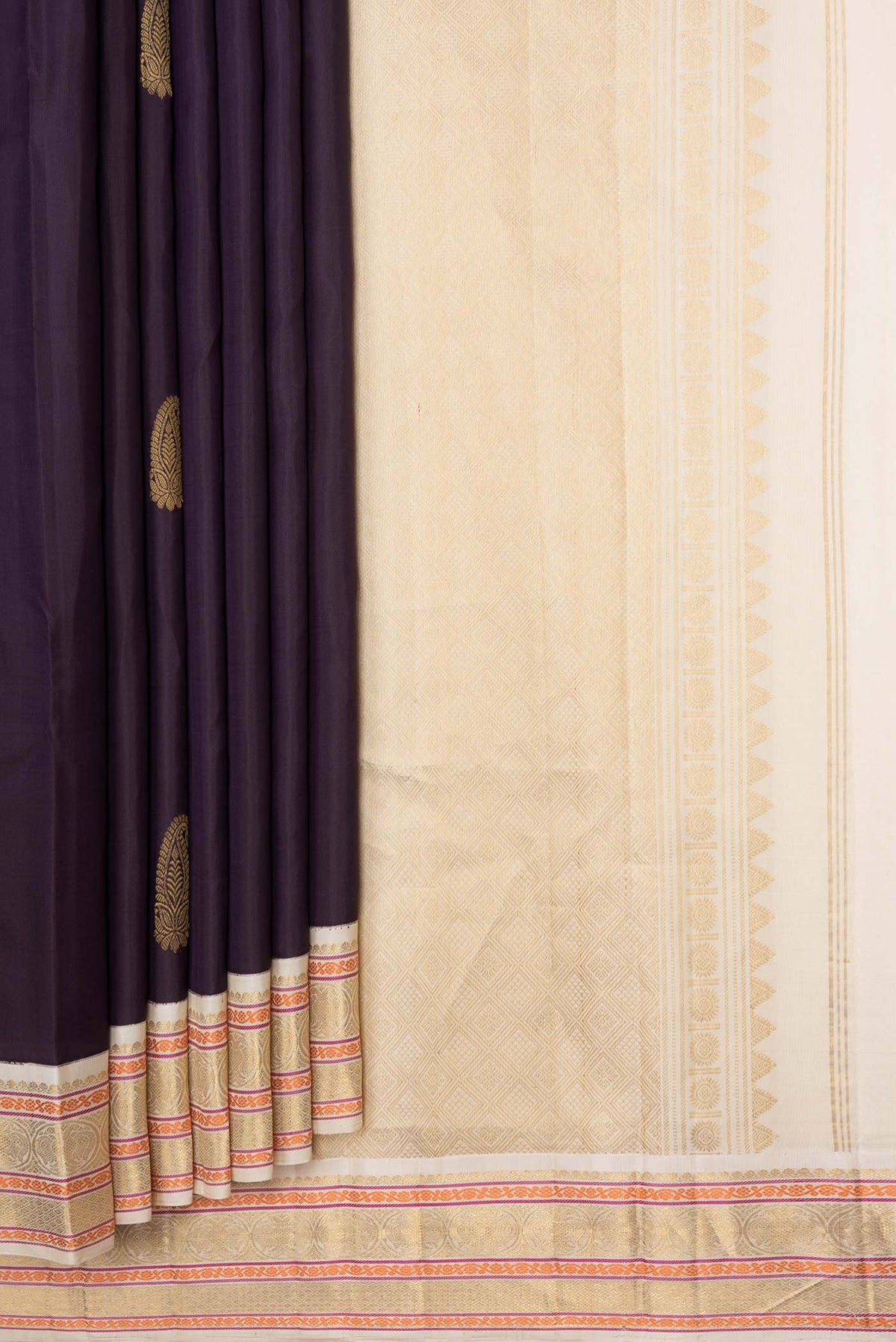Pleats and pallu of Burgundy Dual Tone Kanchipuram Silk Saree with Zari Butta on the body and Zari Border