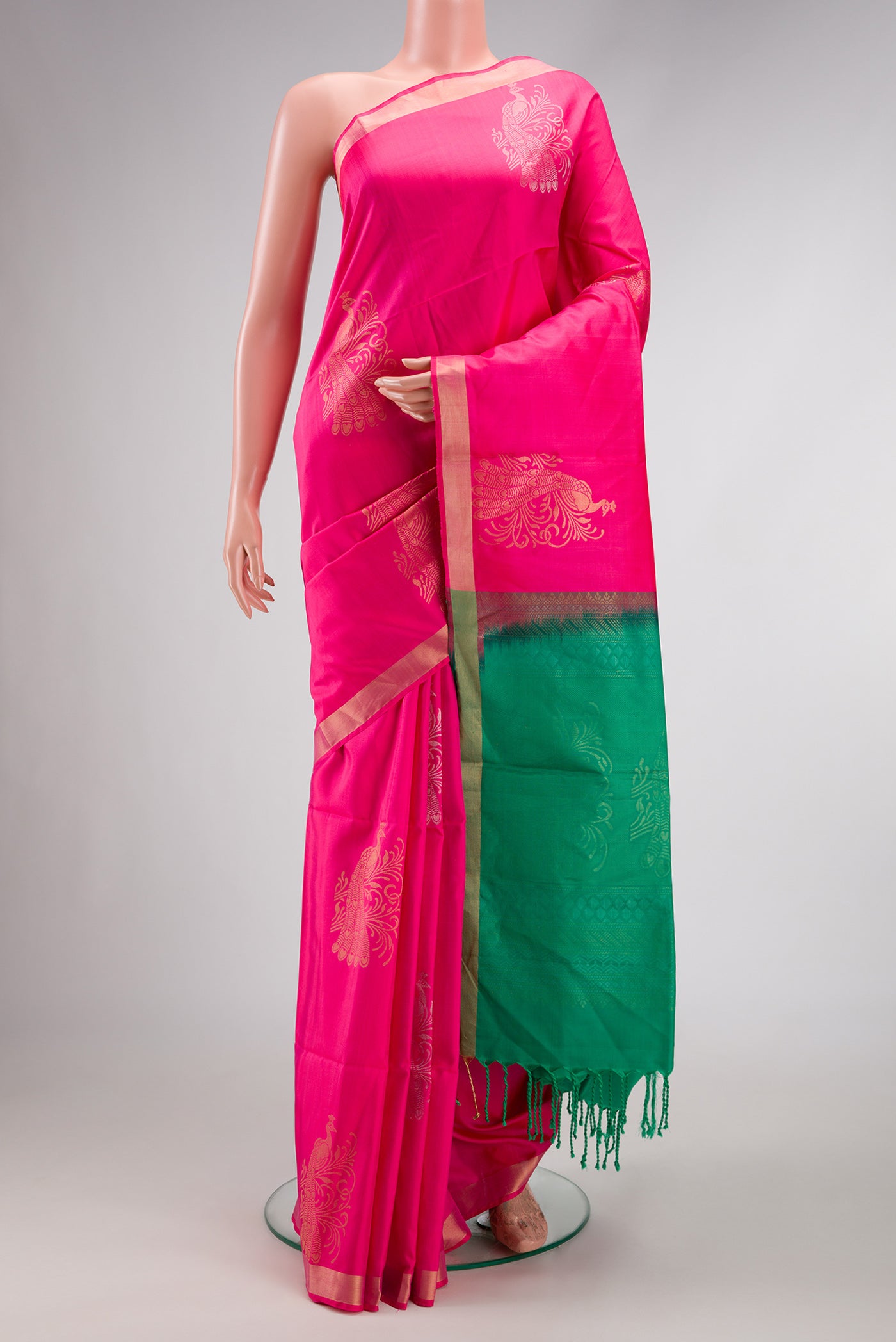 Pink Dual Tone Soft Silk Saree with Zari Butta on the body and Zari Border.  displayed on a mannequin