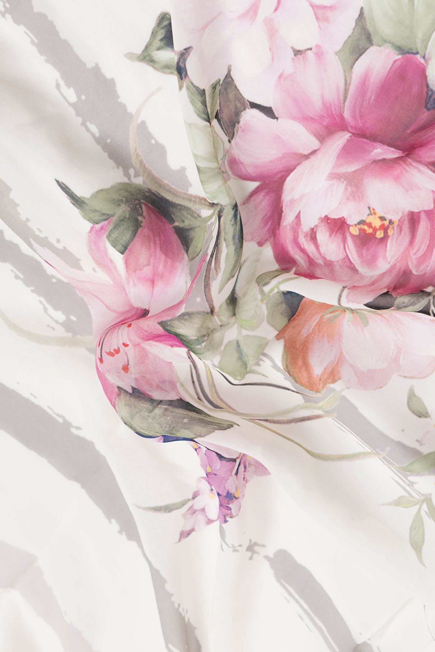 Close up of Beige Dual Tone Mysore Crepe Saree with Printed design on the body and Printed Border.  displaying folds