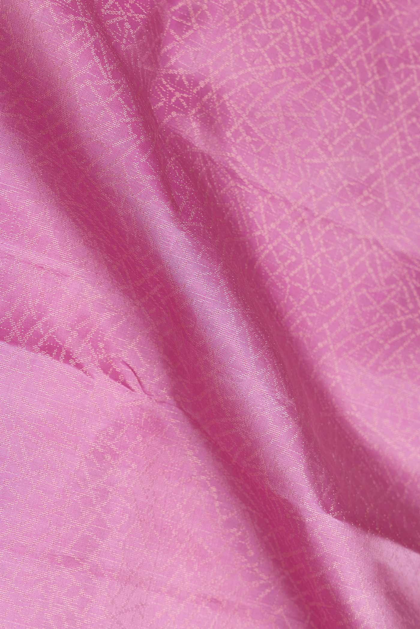 Close up of Pink Dual Tone Soft Silk Saree with Zari Brocade on the body and Zari Border.  displaying folds