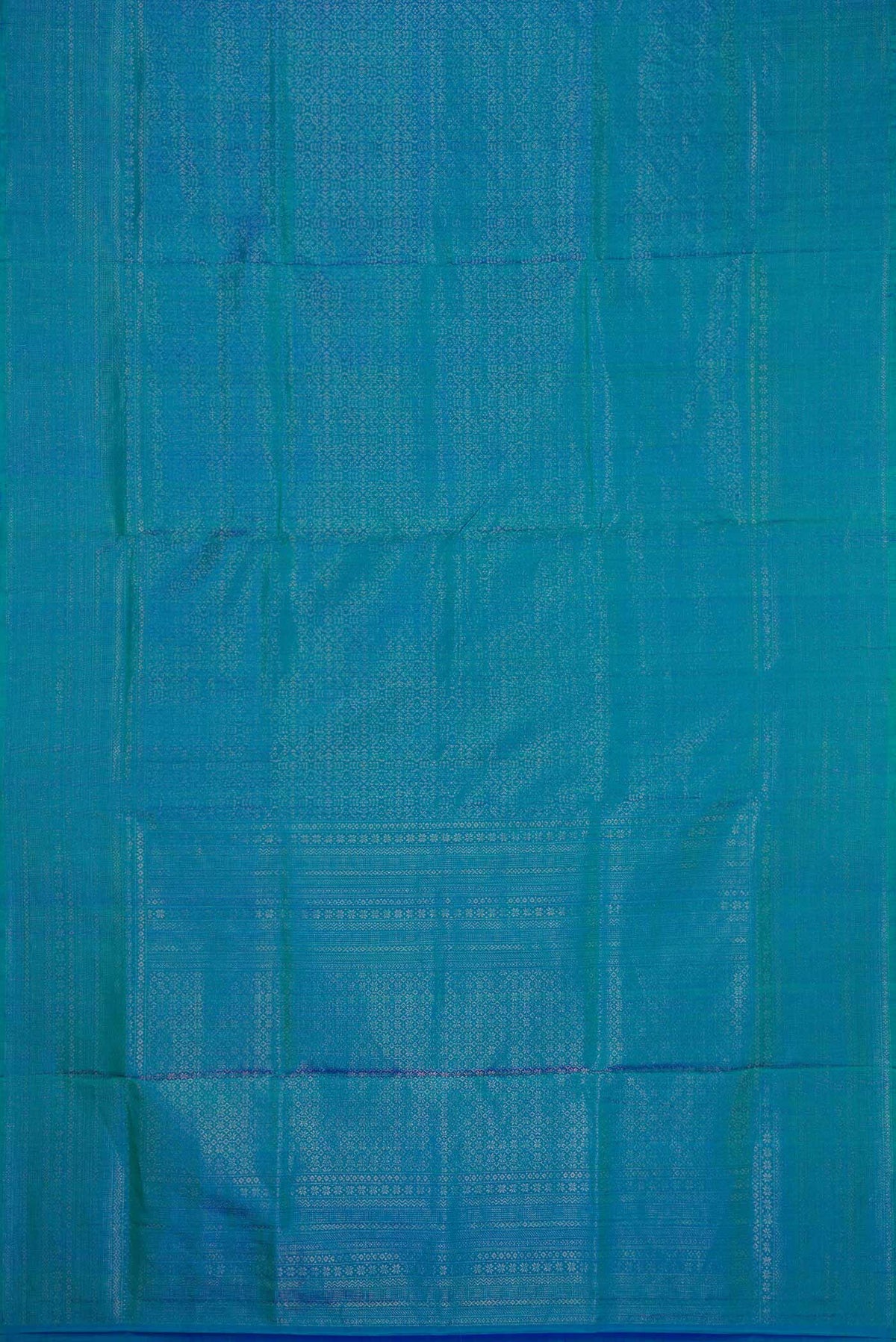 Flat view of Peacock Blue Dual Tone Soft Silk Saree with Zari Brocade on the body and Zari Border. 