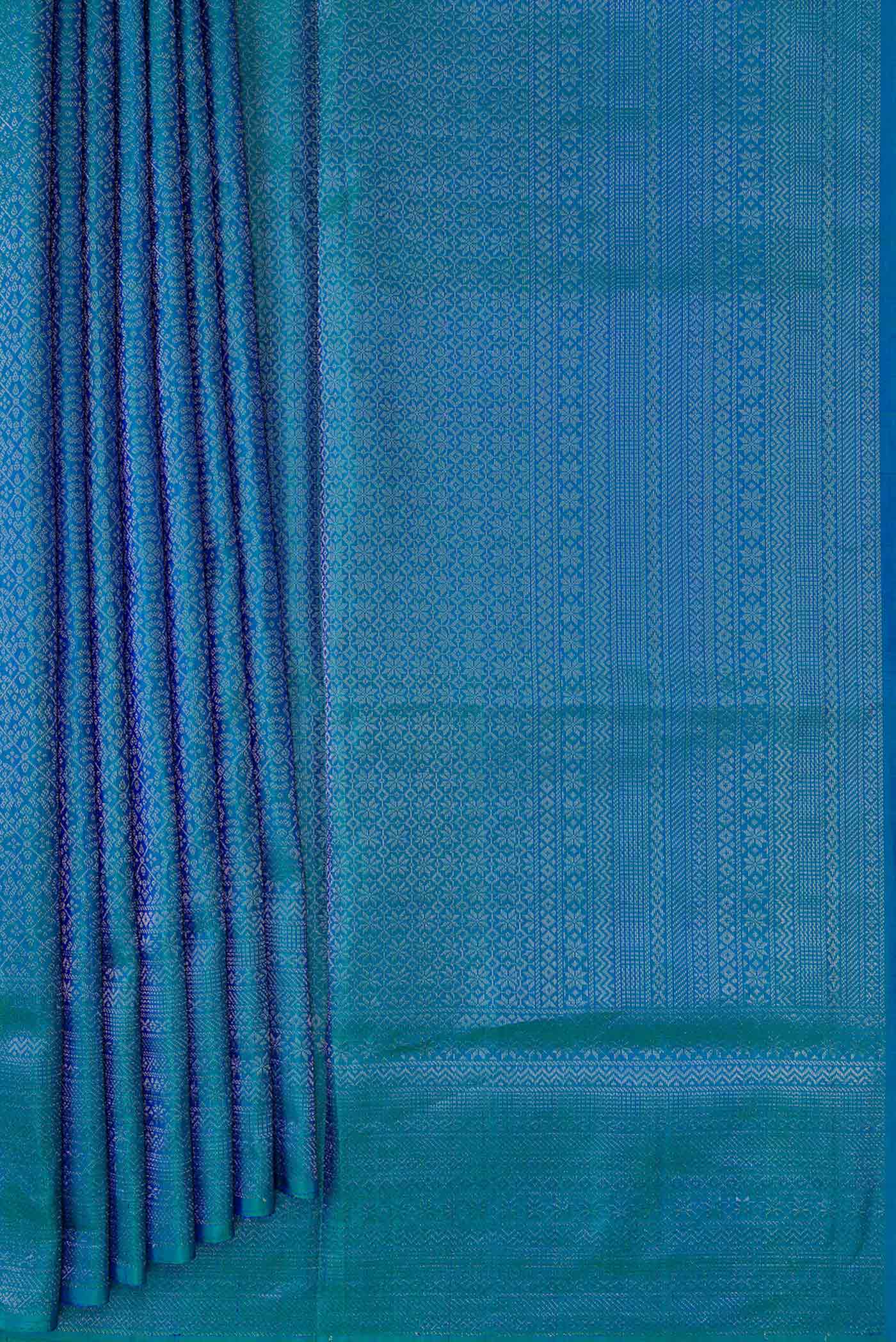 Pleats and pallu of Peacock Blue Dual Tone Soft Silk Saree with Zari Brocade on the body and Zari Border. 