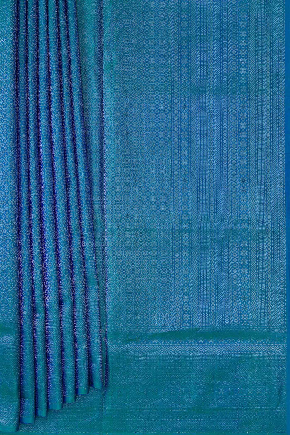 Pleats and pallu of Peacock Blue Dual Tone Soft Silk Saree with Zari Brocade on the body and Zari Border. 