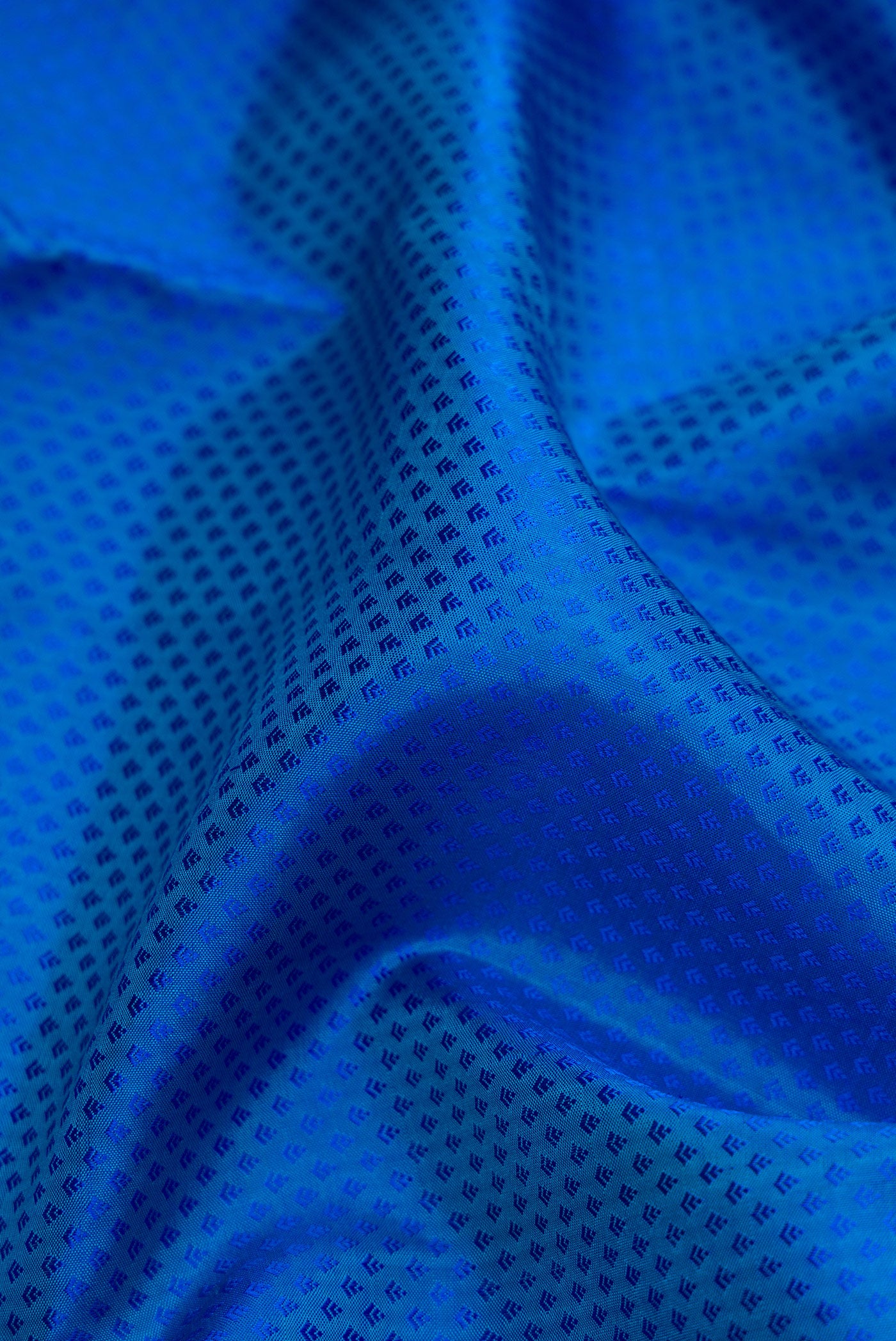 Close up of Royal Blue Dual Tone Kanjivaram Silk Saree with Jacquard design on the body and Zari Border.  displaying folds
