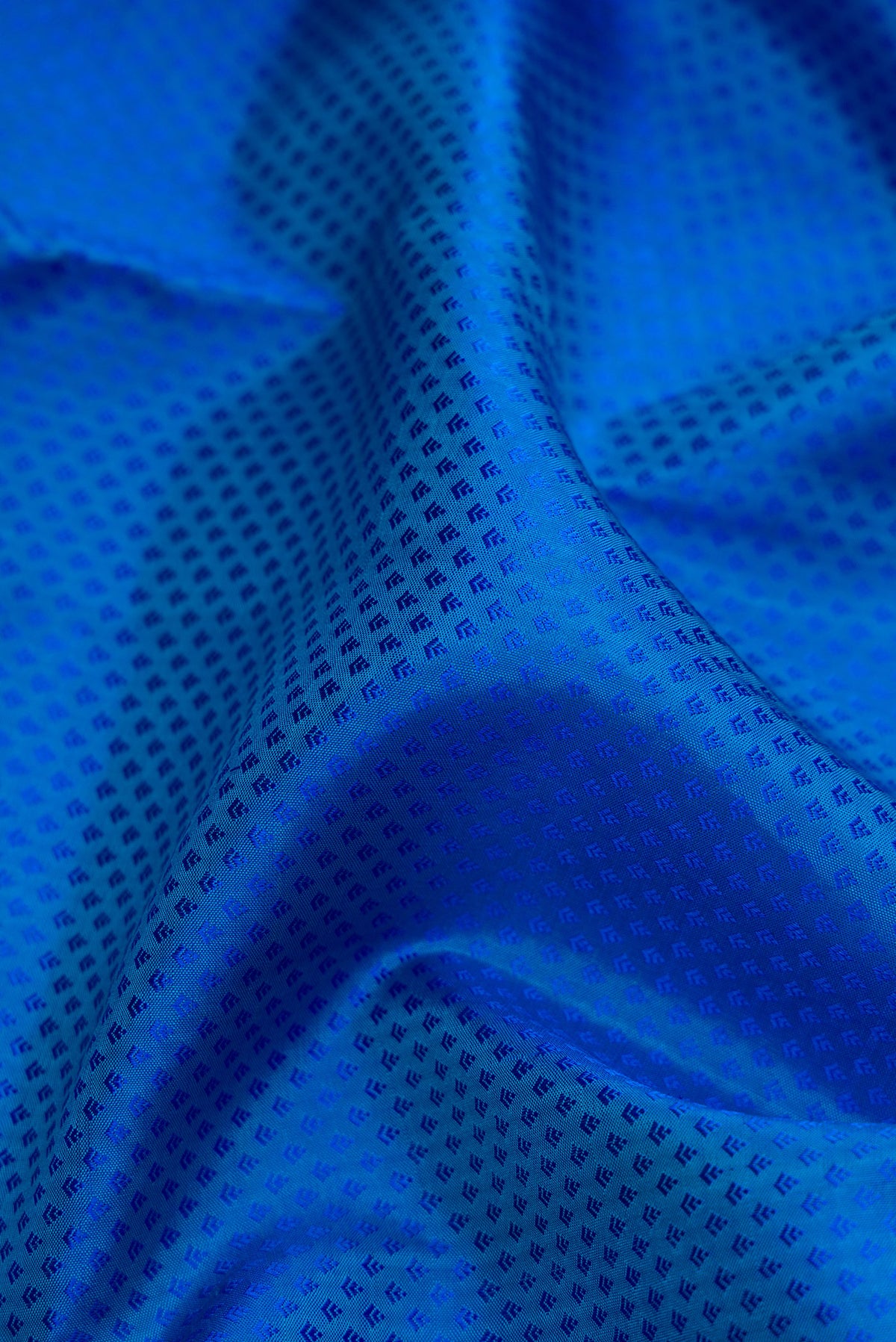 Close up of Royal Blue Dual Tone Kanjivaram Silk Saree with Jacquard design on the body and Zari Border.  displaying folds