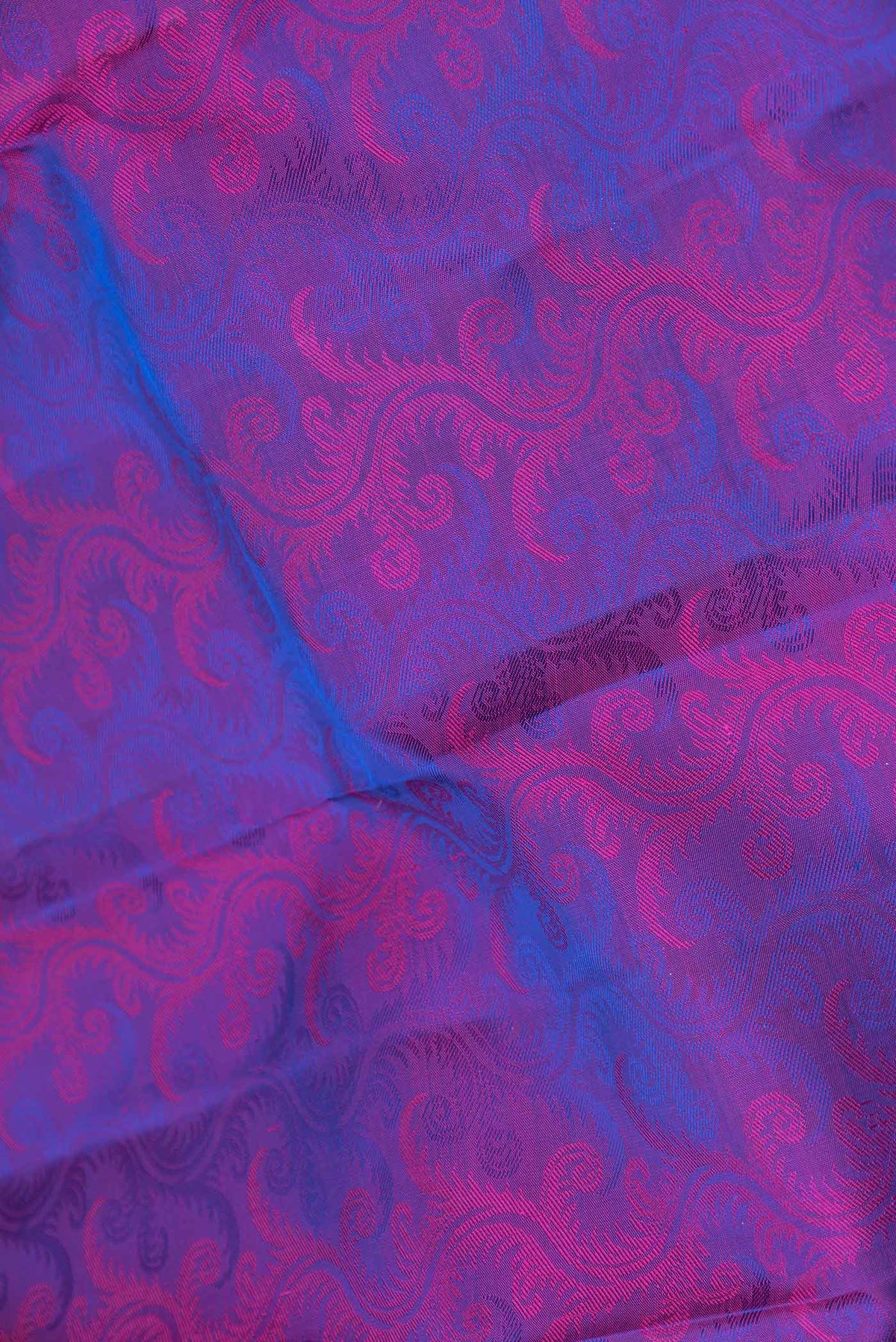 Close up of Purple Dual Tone Kanchipuram Silk Saree with Jacquard design on the body and Zari Border displaying folds