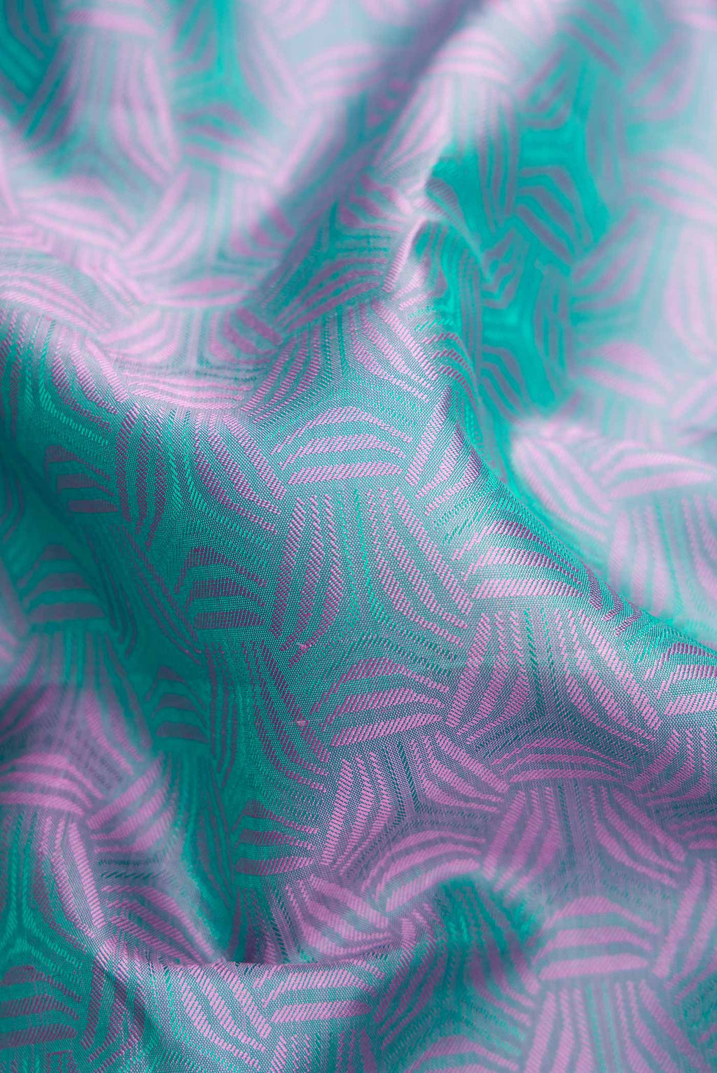 Close up of Pure Silk Pure Zari Green Dual Tone Kanchipuram Saree with Jacquard design on the body and Zari Border.  displaying folds