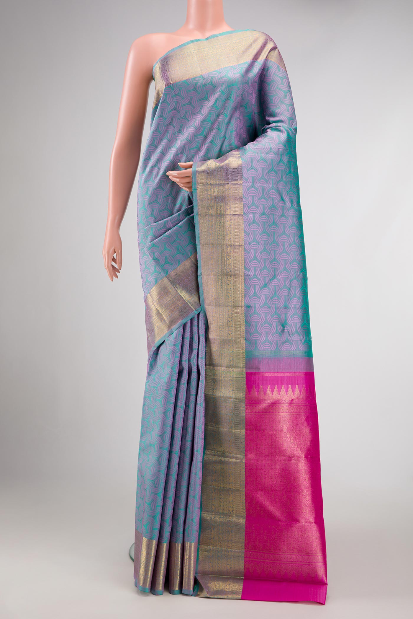 Pure Silk Pure Zari Green Dual Tone Kanchipuram Saree with Jacquard design on the body and Zari Border.  displayed on a mannequin