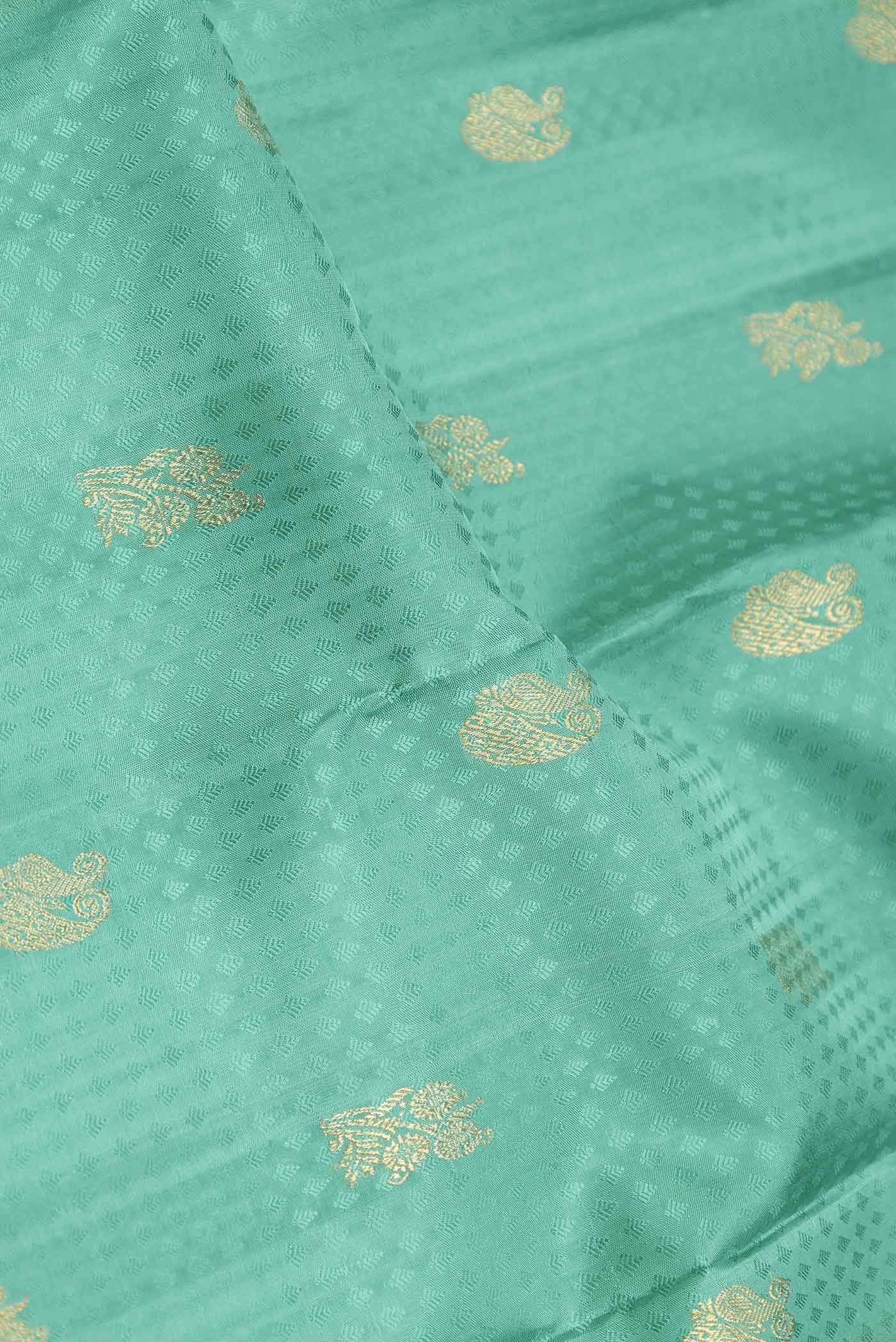 Close up of Pure Silk Pure Zari Green Dual Tone Kanchipuram Saree with Jacquard With Zari Butta on the body and Zari Border displaying folds