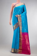 Pure Silk Pure Zari Sky Blue Dual Tone Kanchipuram Saree with Jacquard With Zari Butta on the body and Zari Border.  displayed on a mannequin