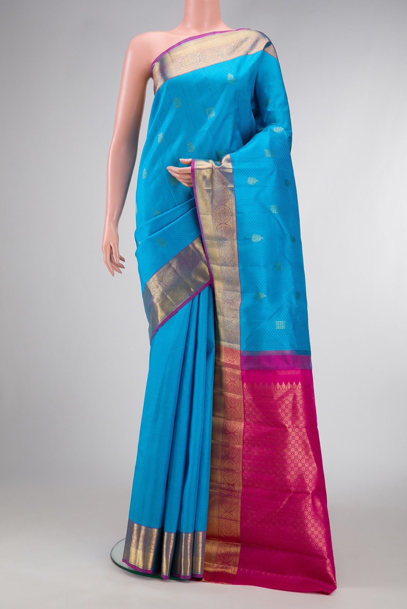 Pure Silk Pure Zari Sky Blue Dual Tone Kanchipuram Saree with Jacquard With Zari Butta on the body and Zari Border.  displayed on a mannequin