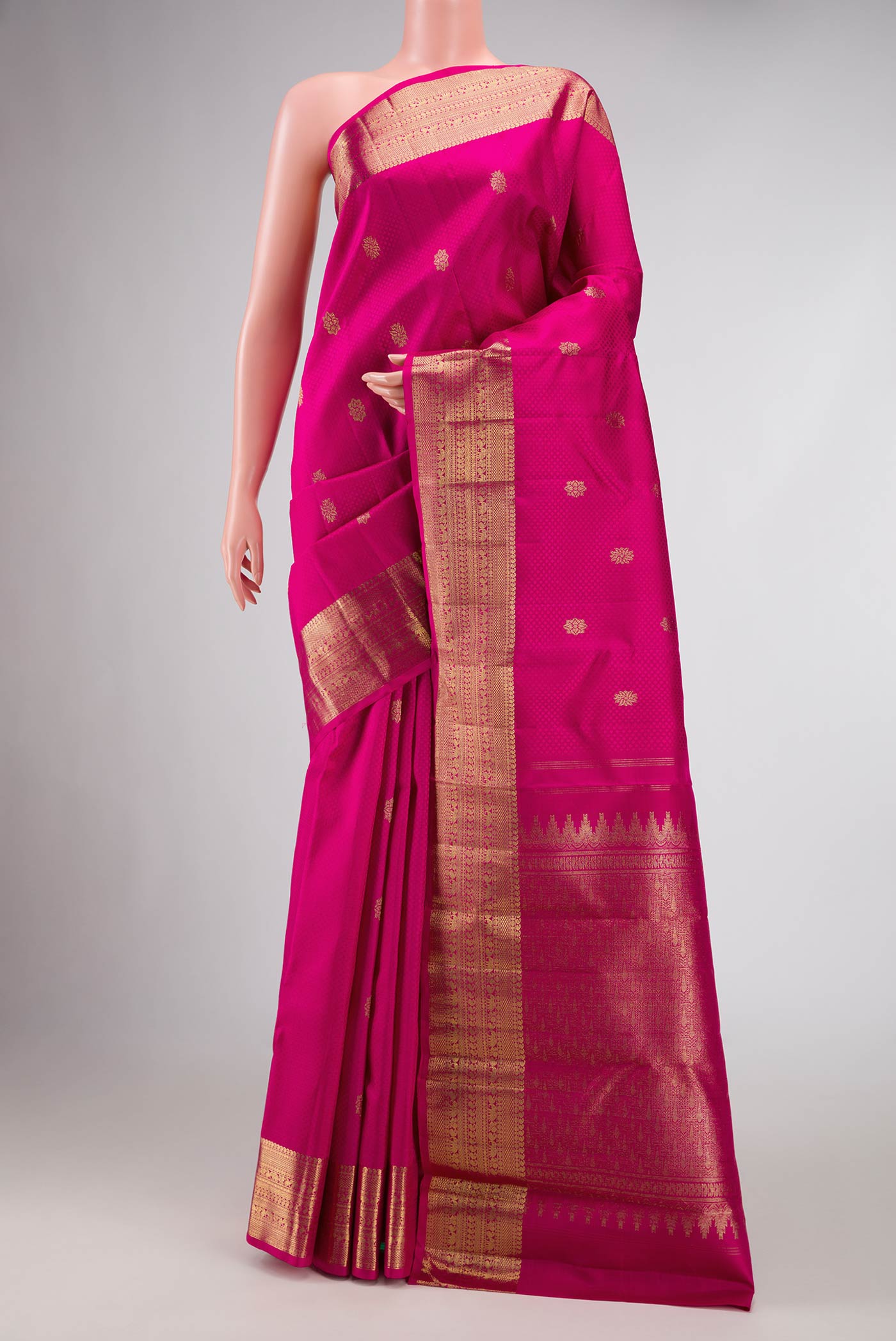 Pure Silk Pure Zari Pink Dual Tone Kanchipuram Saree with Jacquard With Zari Butta on the body and Zari Border.  displayed on a mannequin