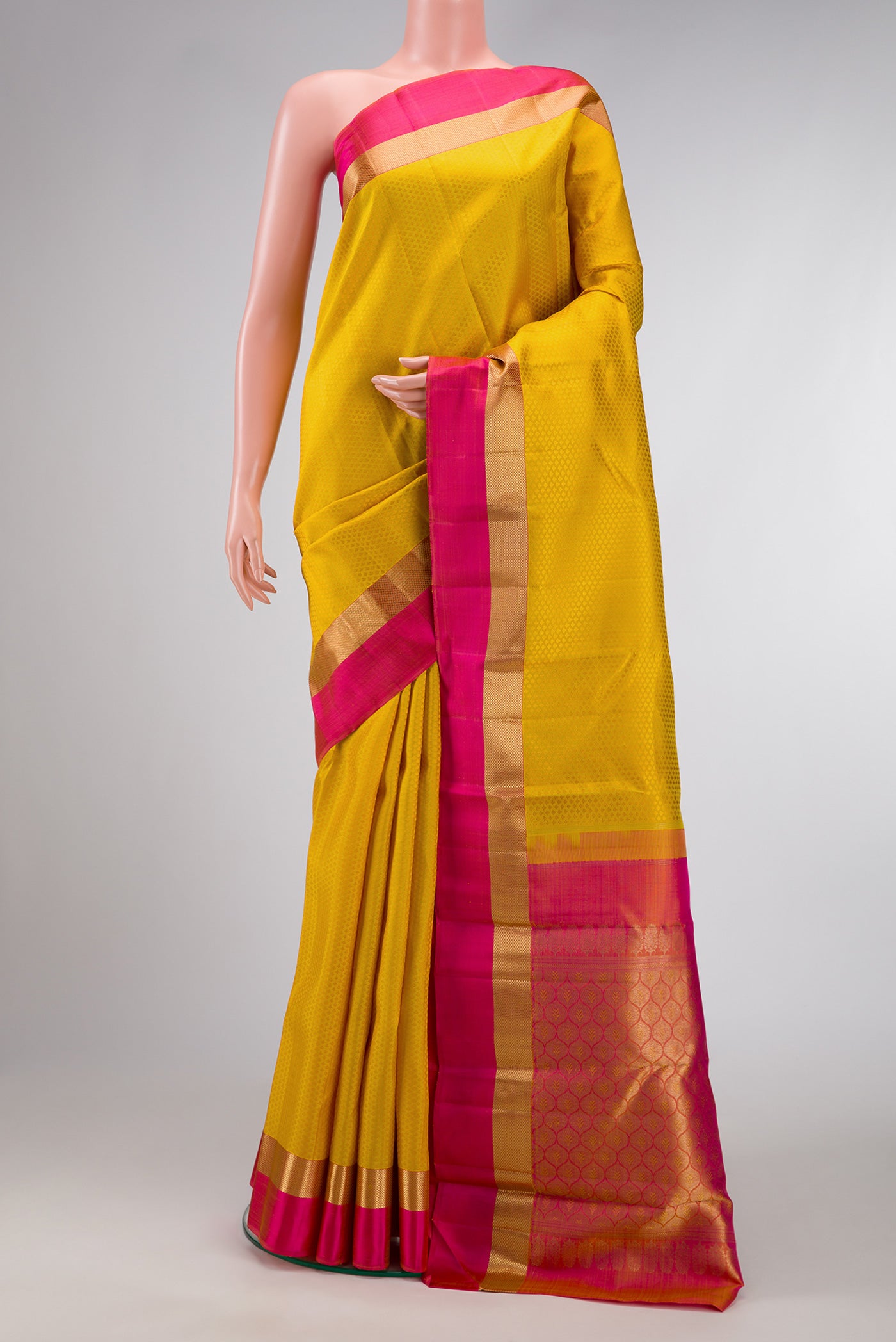 Yellow Dual Tone Kanjivaram Silk Saree with Jacquard design on the body and Zari Border.  displayed on a mannequin