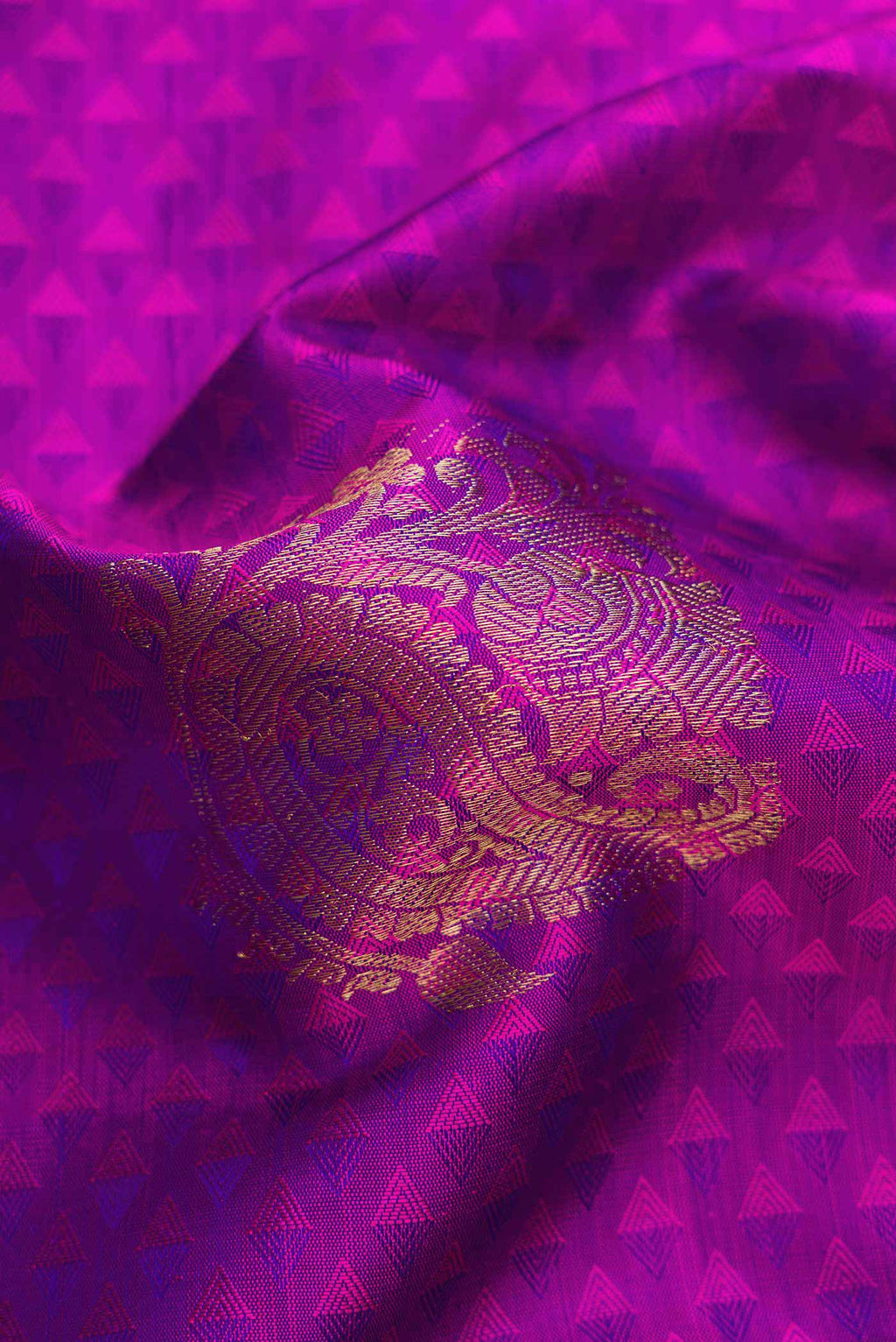 Close up of Pure Silk Pure Zari Purple Dual Tone Kanjivaram Saree with Jacquard With Zari Butta on the body and Zari Border.  displaying folds