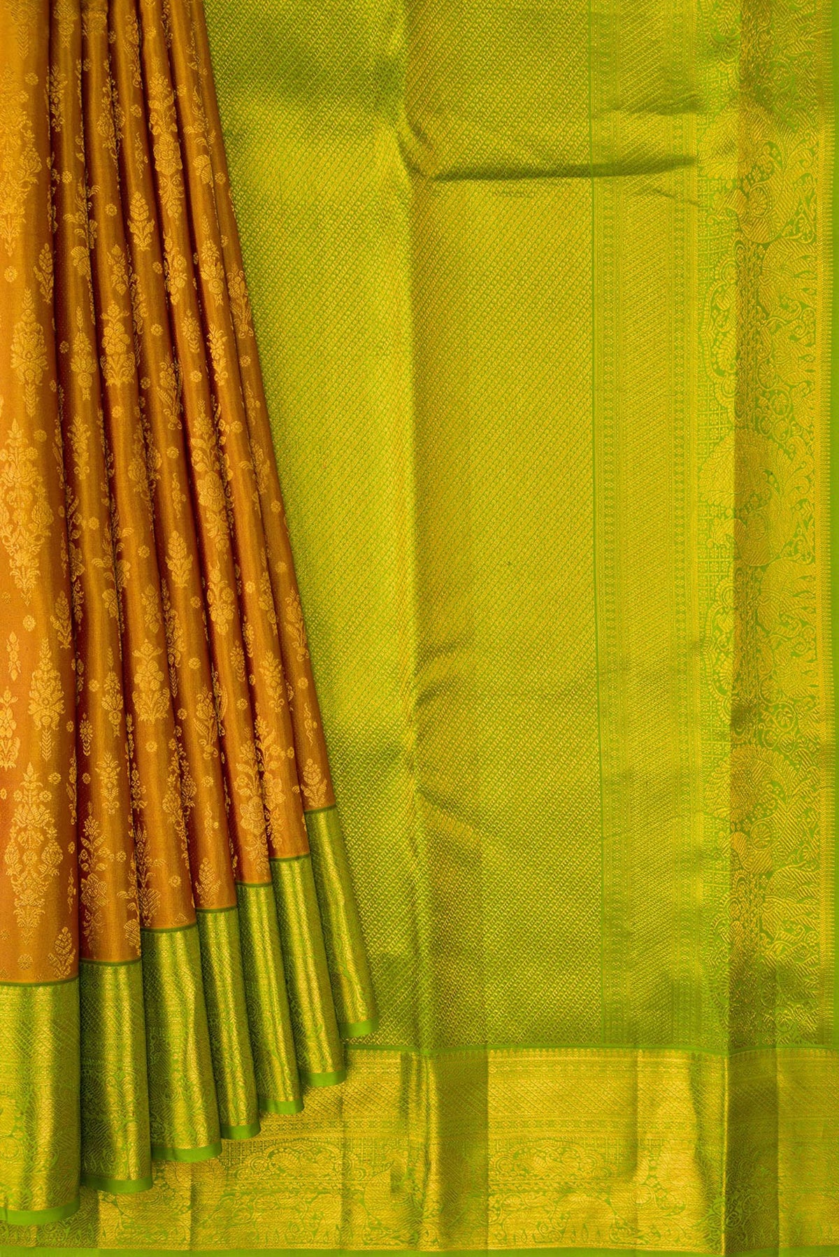 Pleats and pallu of Gold Dual Tone Kanchipuram Silk Saree with Zari Brocade on the body and Zari Border. 