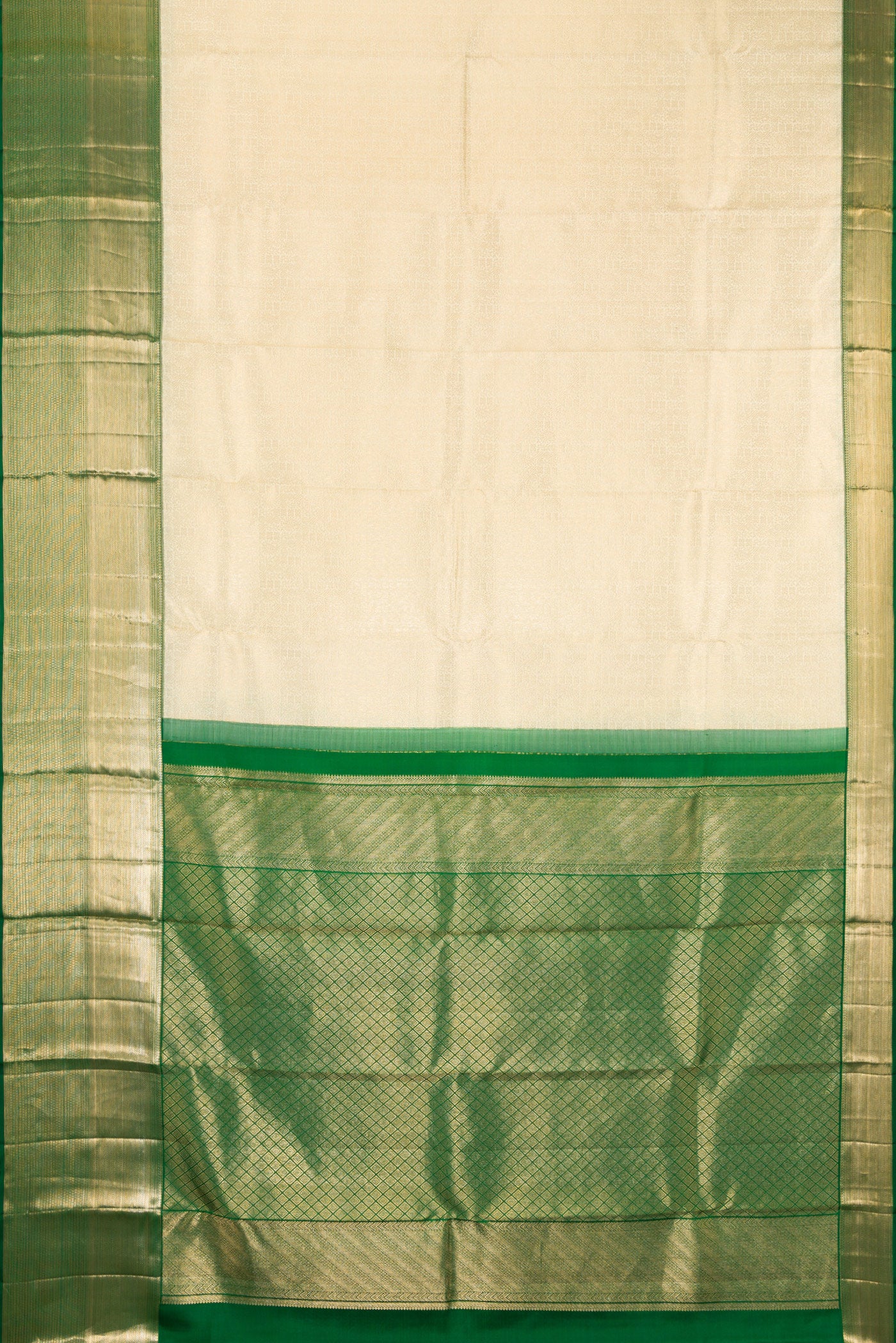 Flat view of Off White Kanchipuram Silk Saree with Zari Brocade on the body and Zari Border. 