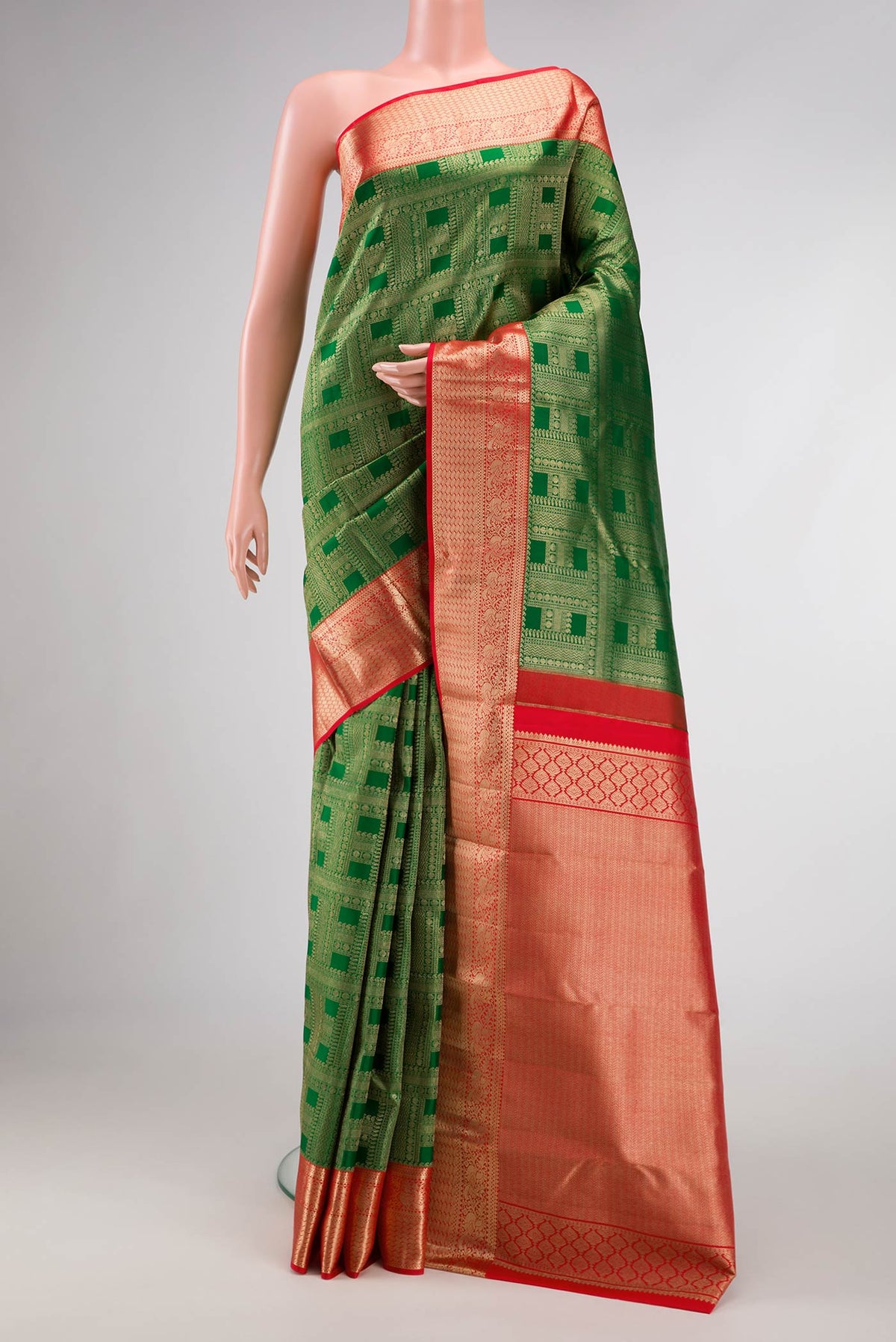Green Dual Tone Kanjivaram Silk Saree with Zari Brocade on the body and Zari Border.  displayed on a mannequin