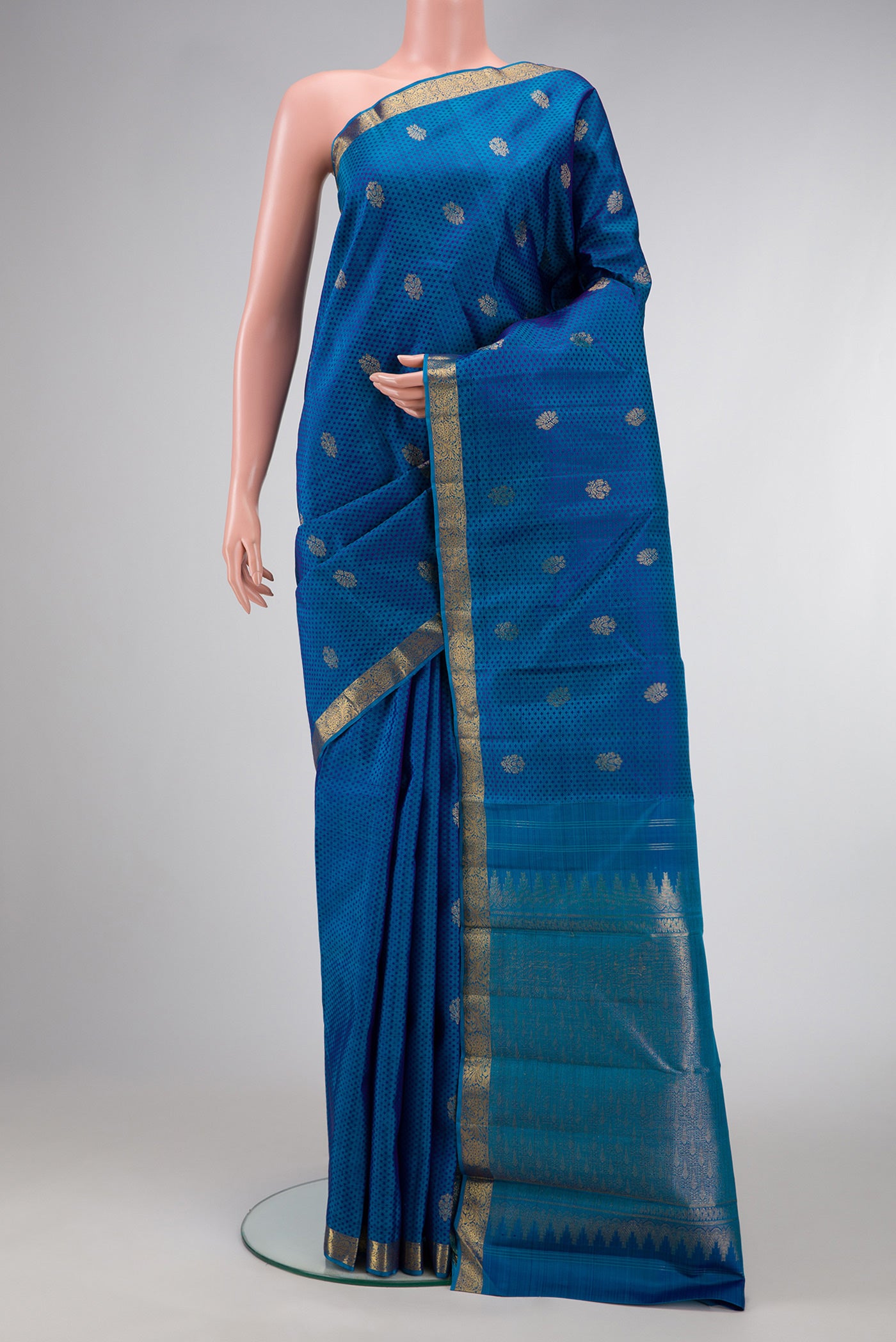 Peacock Blue Dual Tone Kanjivaram Silk Saree with Jacquard With Zari Butta on the body and Zari Border.  displayed on a mannequin
