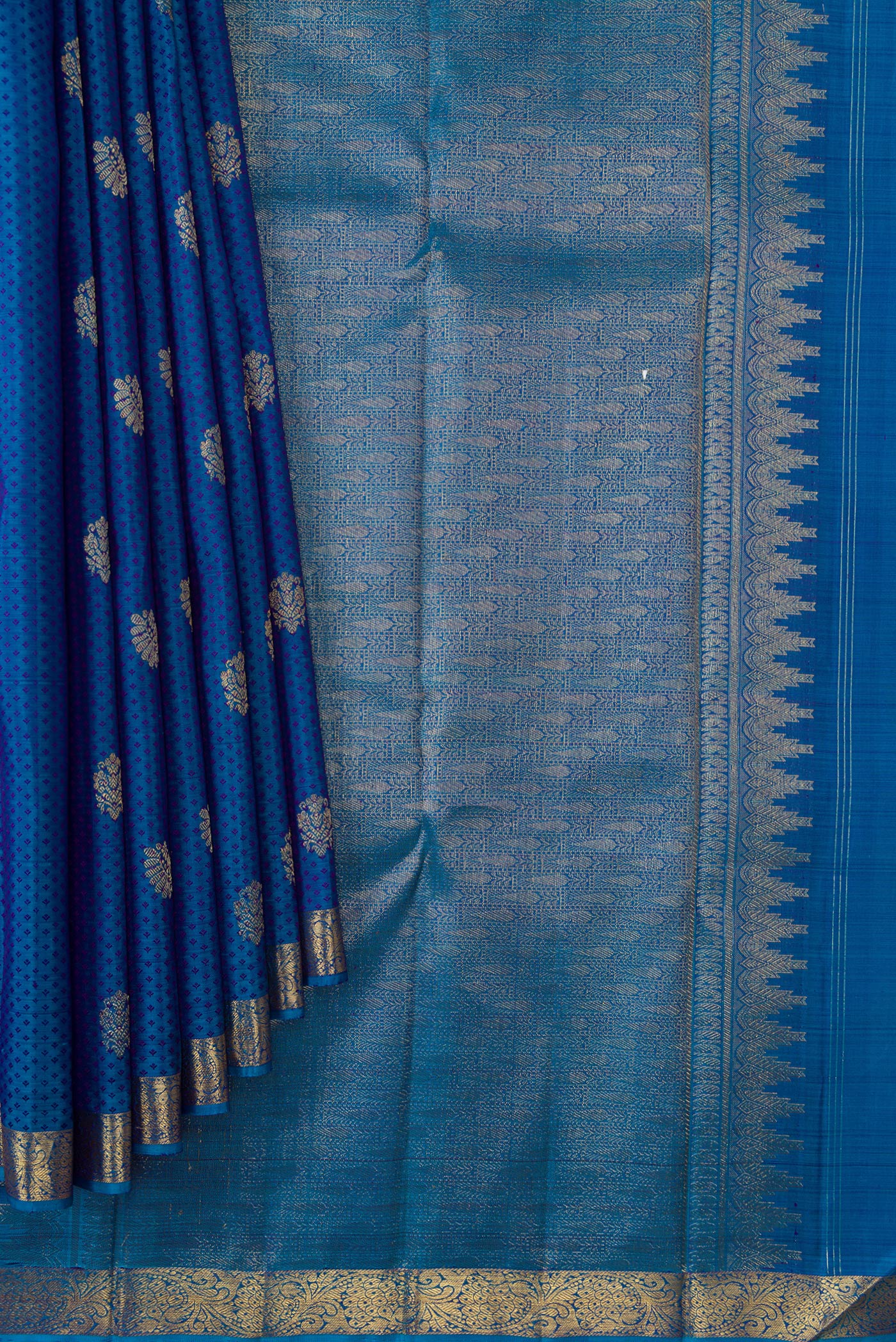 Pleats and pallu of Peacock Blue Dual Tone Kanjivaram Silk Saree with Jacquard With Zari Butta on the body and Zari Border. 