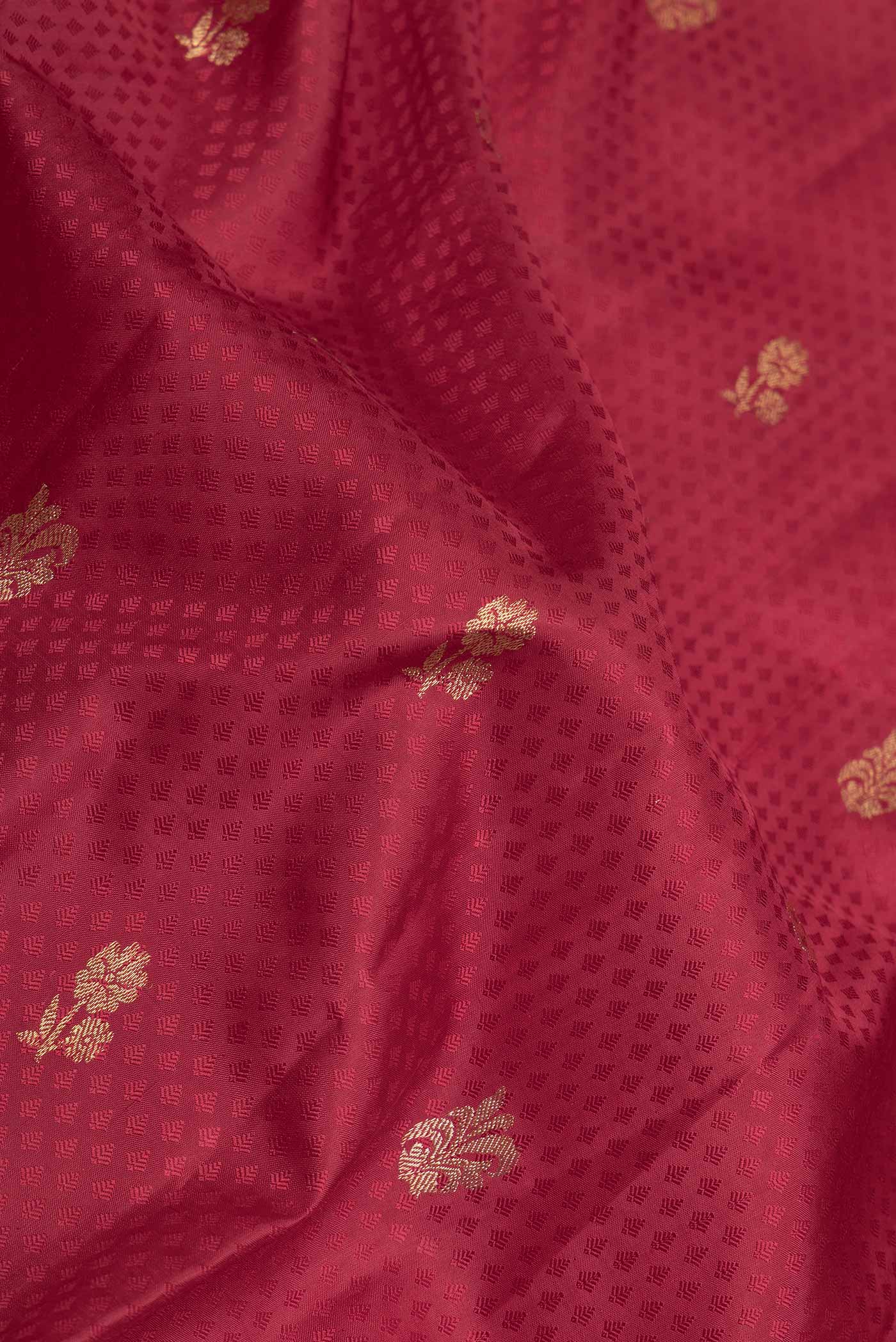 Close up of Maroon Dual Tone Kanchipuram Saree with Jacquard With Zari Butta on the body and Zari Border displaying folds