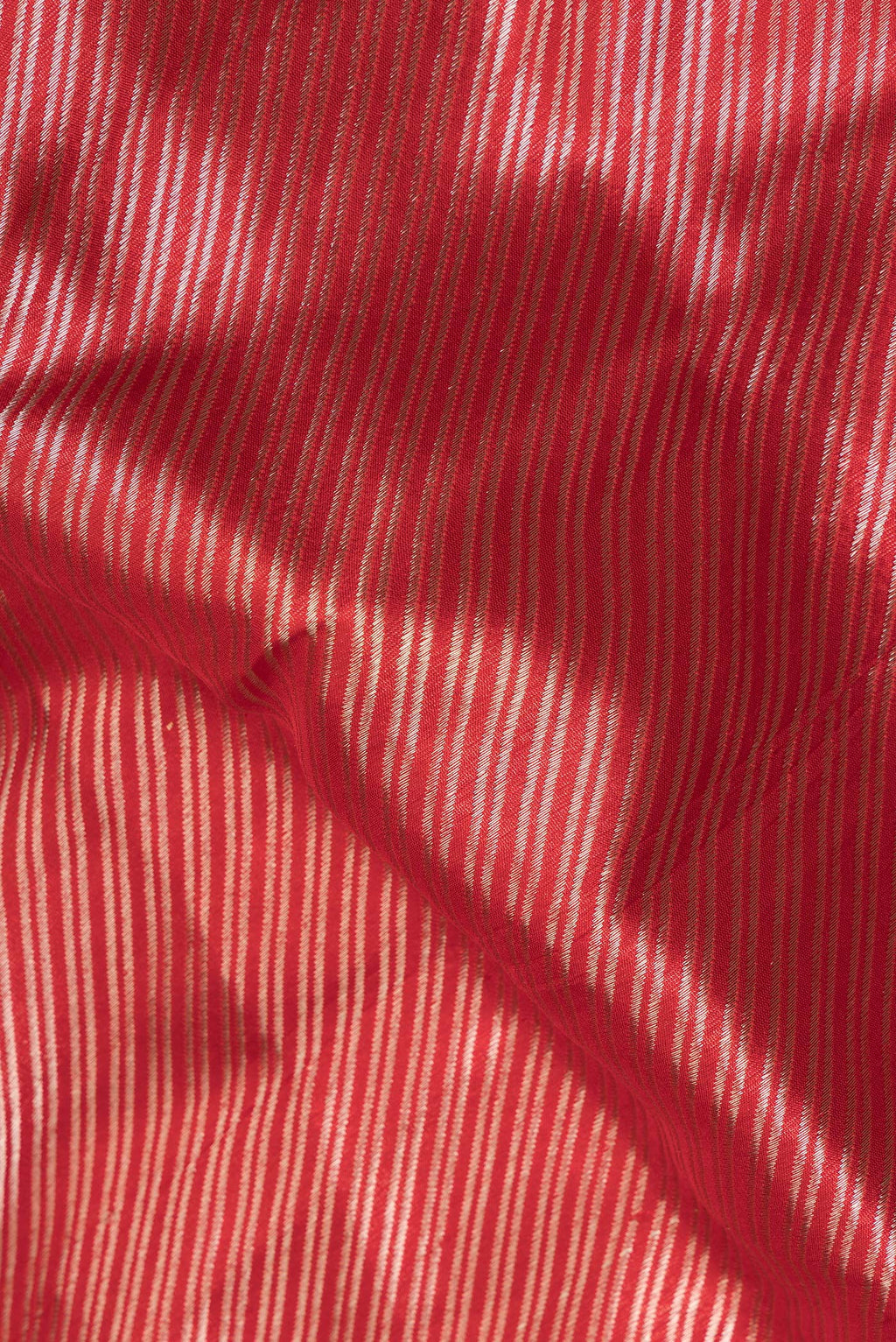 Close up of Pure Silk Red Banarasi Saree with Zari Brocade on the body and Zari Border.  displaying folds