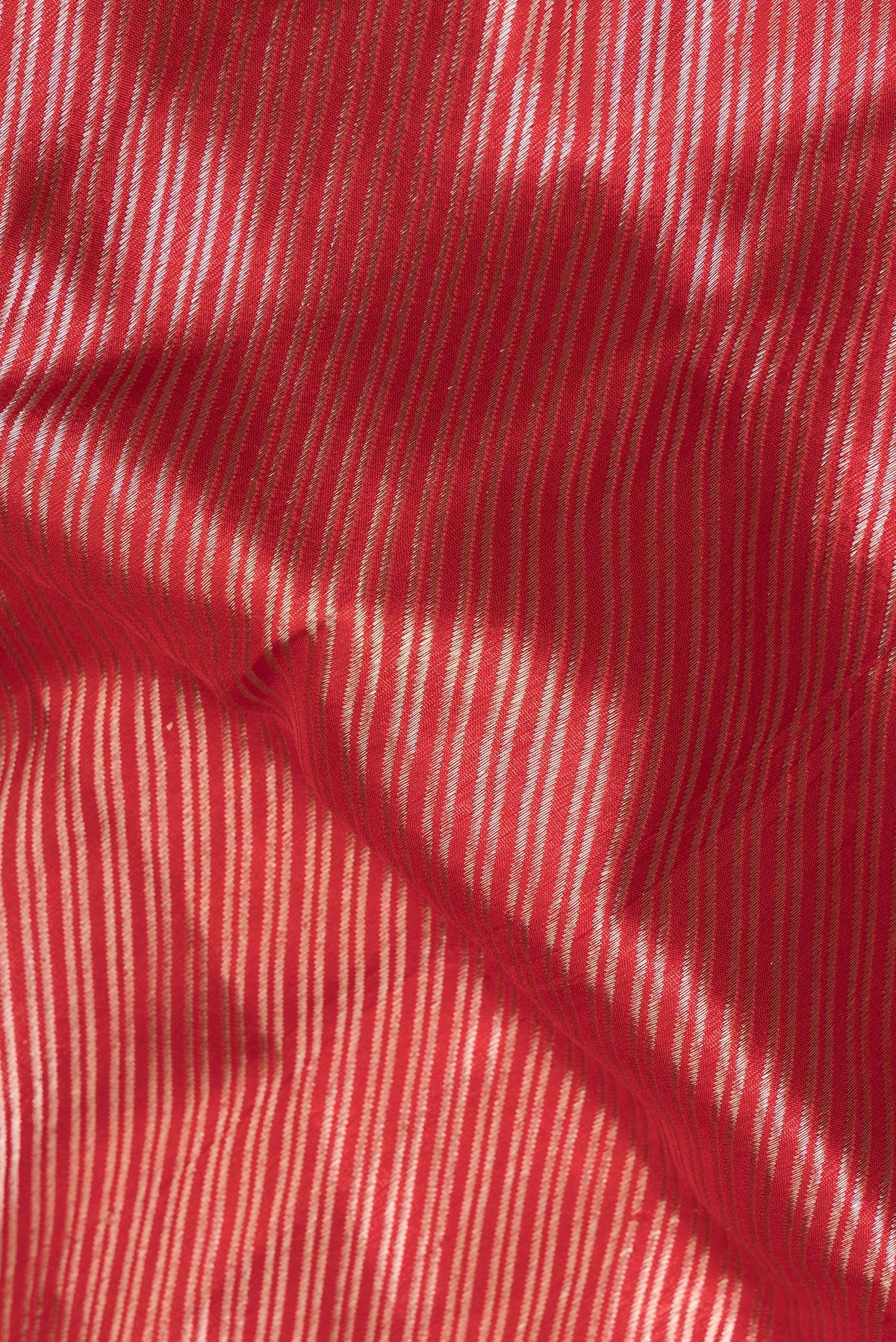 Close up of Pure Silk Red Banarasi Saree with Zari Brocade on the body and Zari Border.  displaying folds