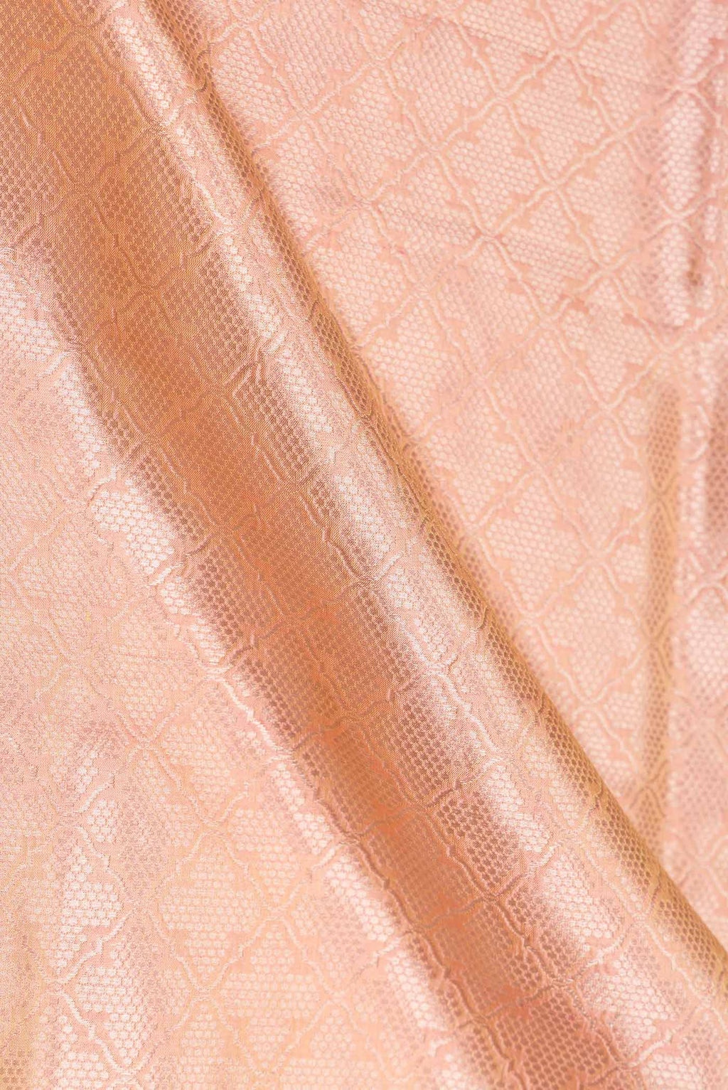 Close up of Peach Banarasi Silk Saree with Zari Brocade on the body and Zari Border displaying folds