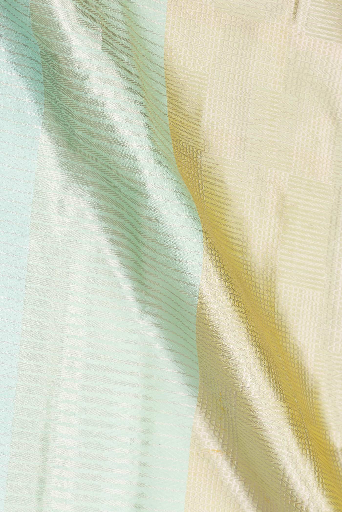 Close up of Multi Color Banarasi Silk Saree with Zari Brocade on the body and Zari Border displaying folds