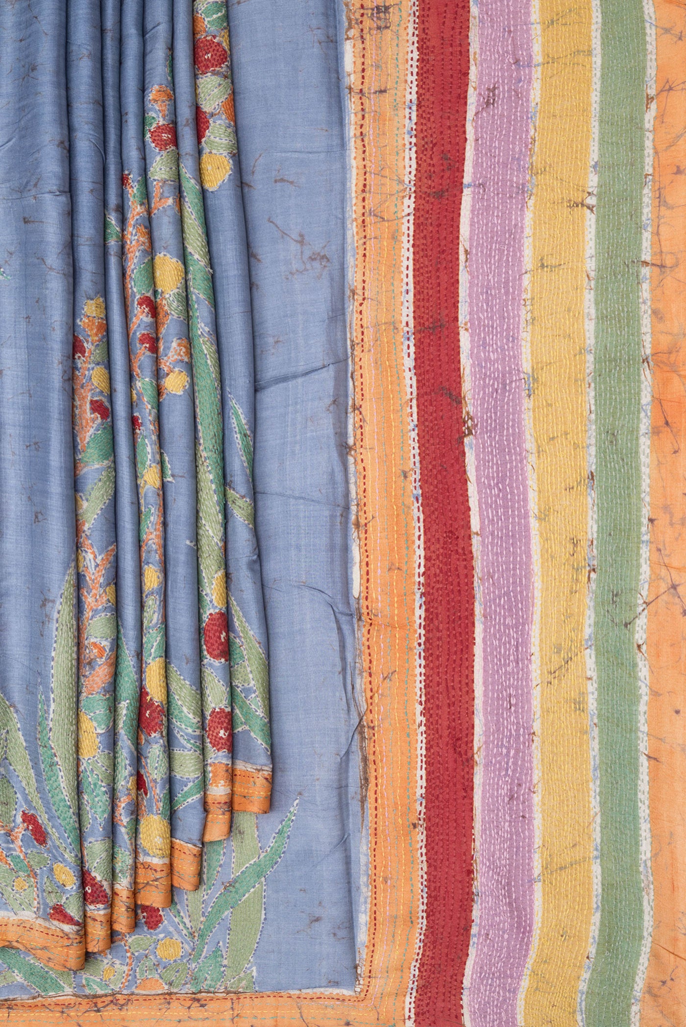 Pleats and pallu of Blue Tussar Silk Saree with Kantha Work on the body and Embroidery Border. 