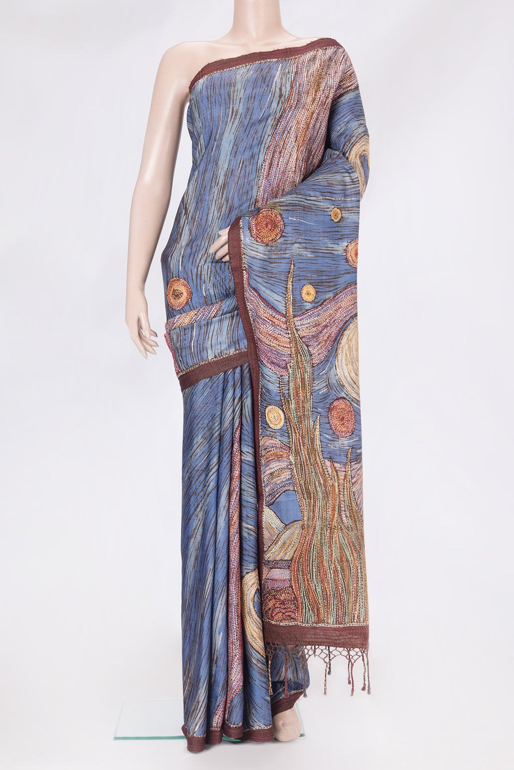 Blue Tussar Silk Saree with Embroidery on the body and Embroidery Border.  displayed on a mannequin