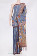 Blue Tussar Silk Saree with Embroidery on the body and Embroidery Border.  displayed on a mannequin