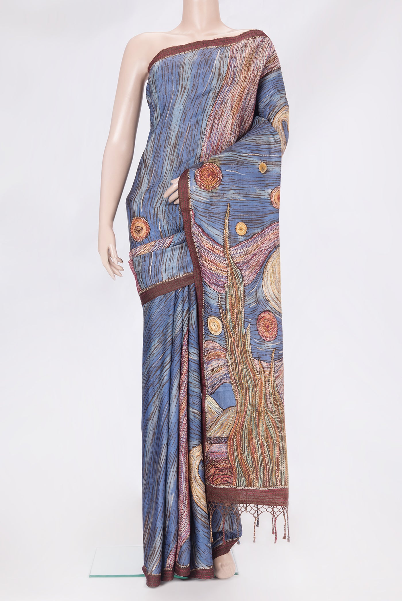 Blue Tussar Silk Saree with Embroidery on the body and Embroidery Border.  displayed on a mannequin