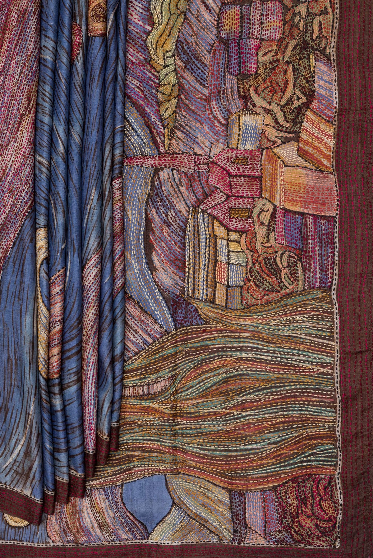 Pleats and pallu of Blue Tussar Silk Saree with Embroidery on the body and Embroidery Border. 