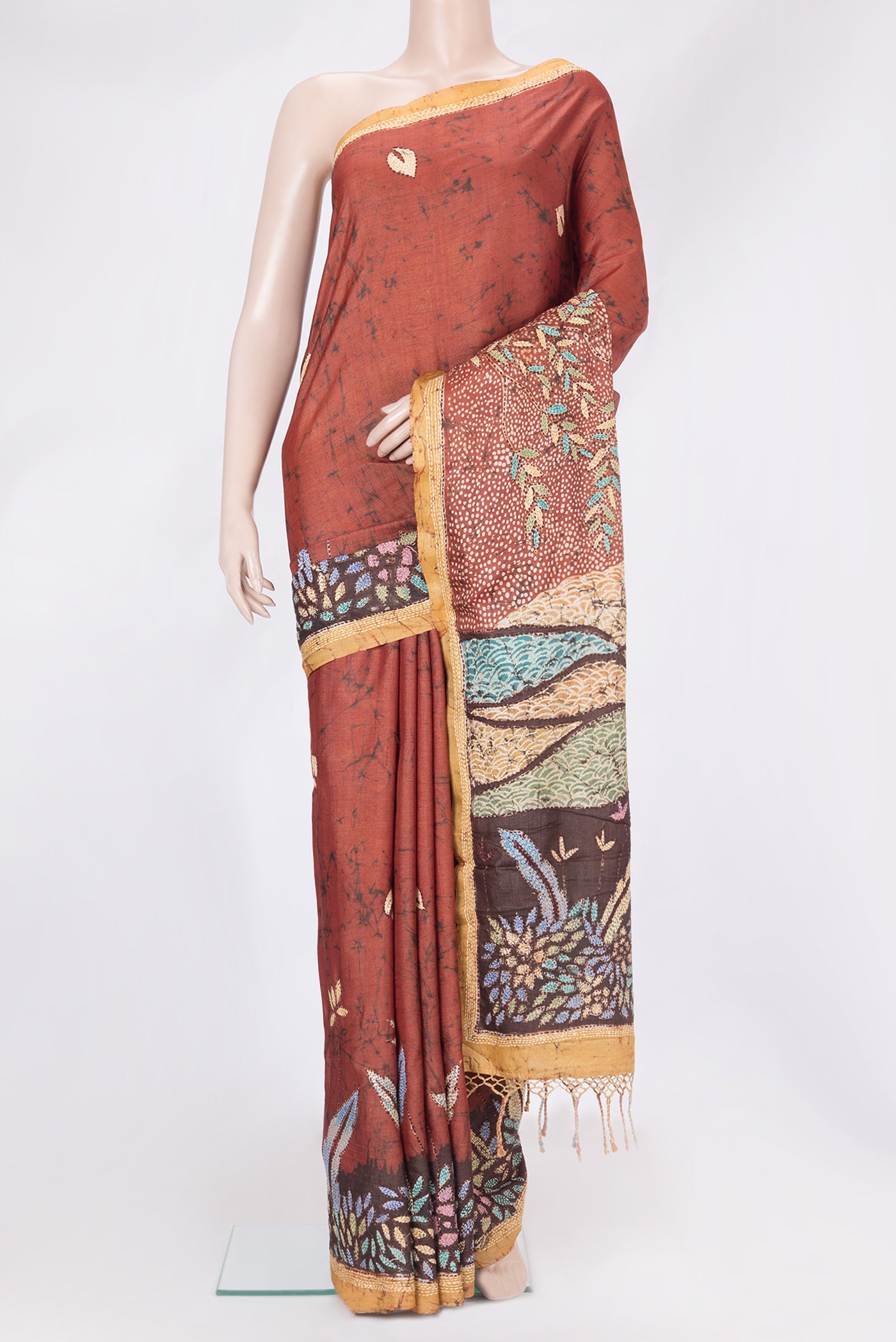 Brick Orange Tussar Silk Saree with Embroidery on the body and Embroidery Border.  displayed on a mannequin