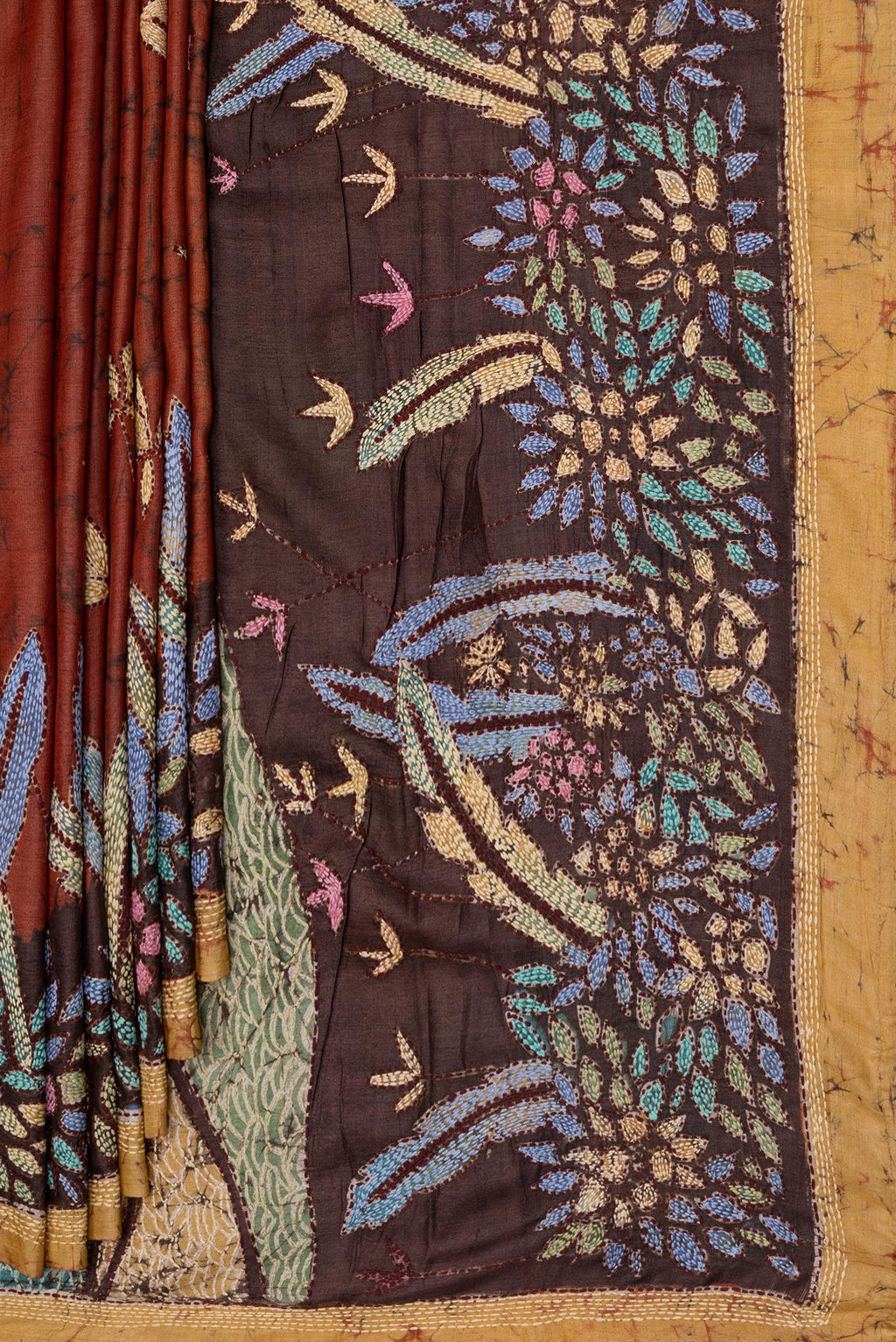 Pleats and pallu of Brick Orange Tussar Silk Saree with Embroidery on the body and Embroidery Border. 