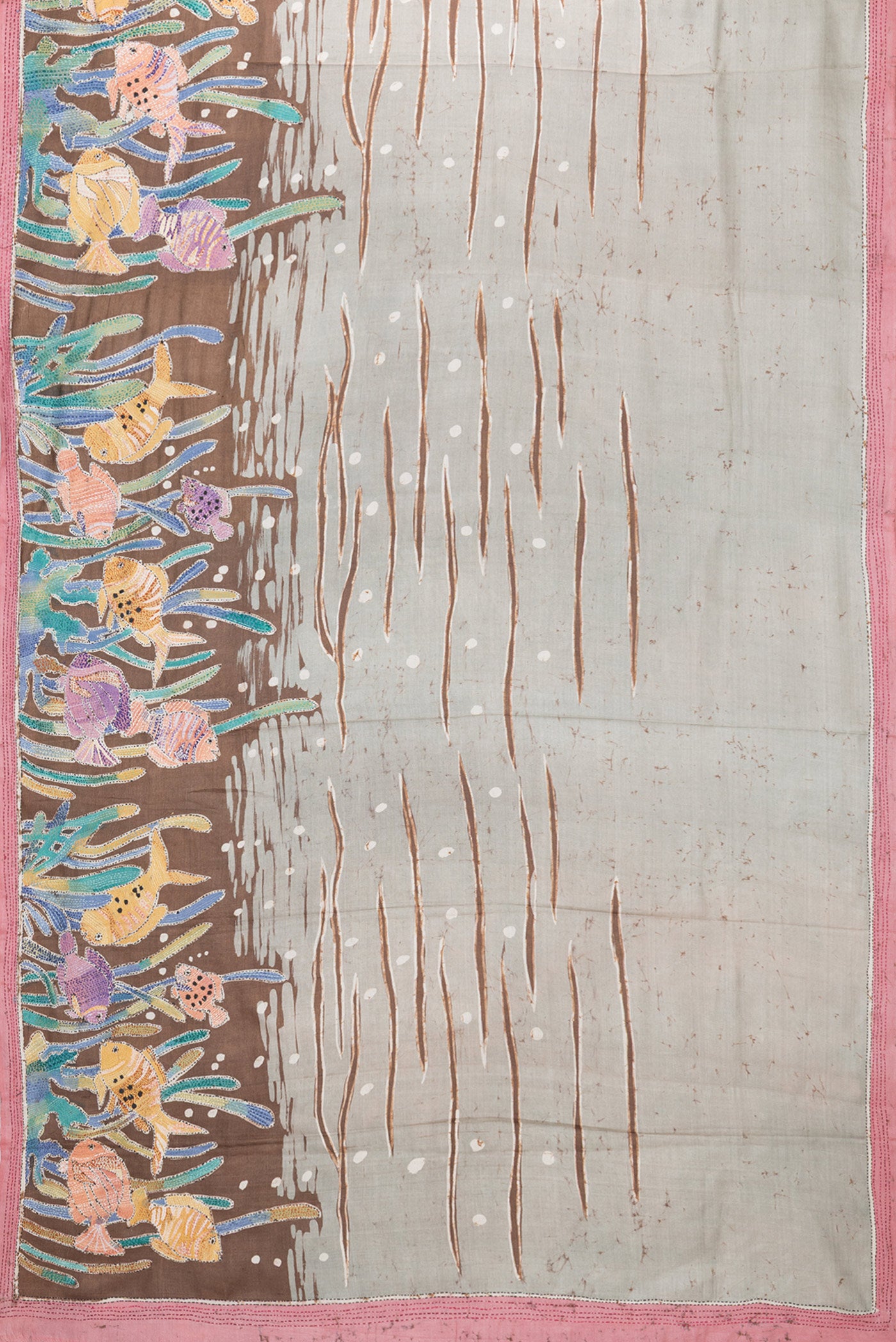 Flat view of Grey Tussar Silk Saree with Embroidery on the body and Embroidery Border. 