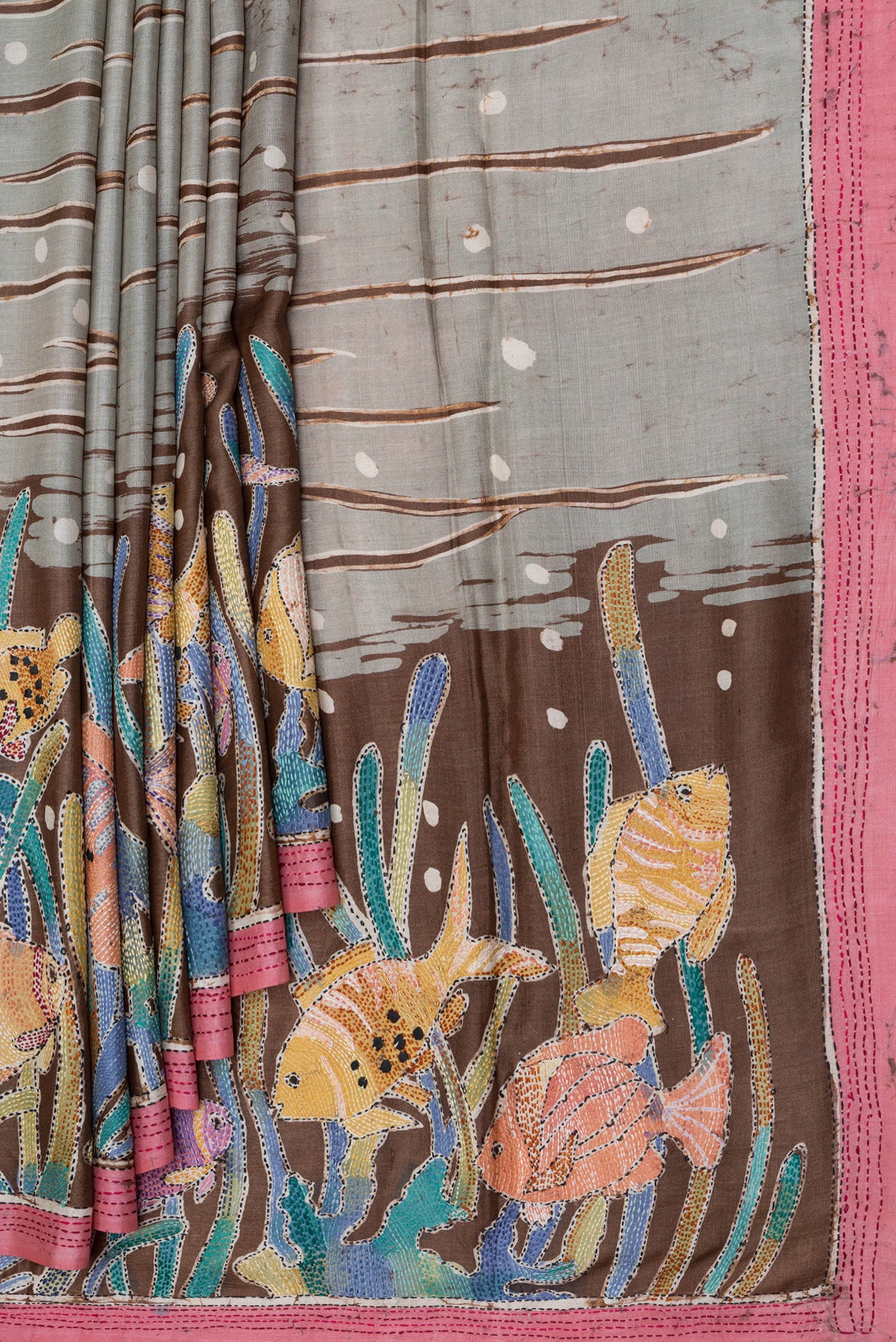 Pleats and pallu of Grey Tussar Silk Saree with Embroidery on the body and Embroidery Border. 