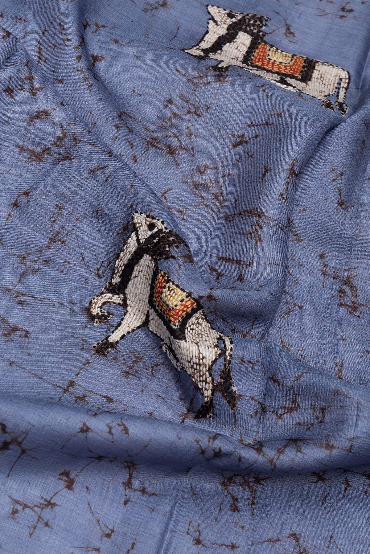 Close up of Lilac Tussar Silk Saree with Embroidery on the body and Embroidery Border.  displaying folds