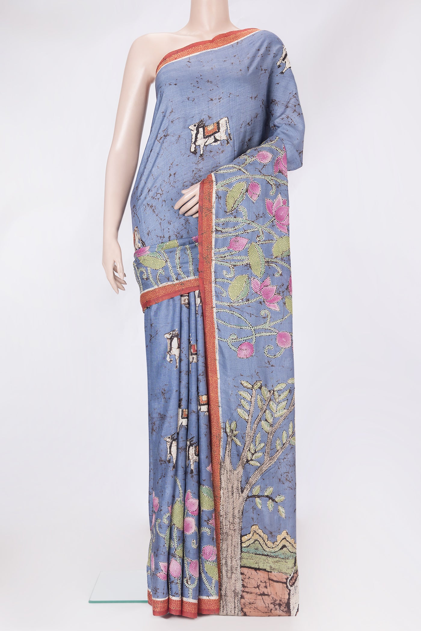 Lilac Tussar Silk Saree with Embroidery on the body and Embroidery Border.  displayed on a mannequin