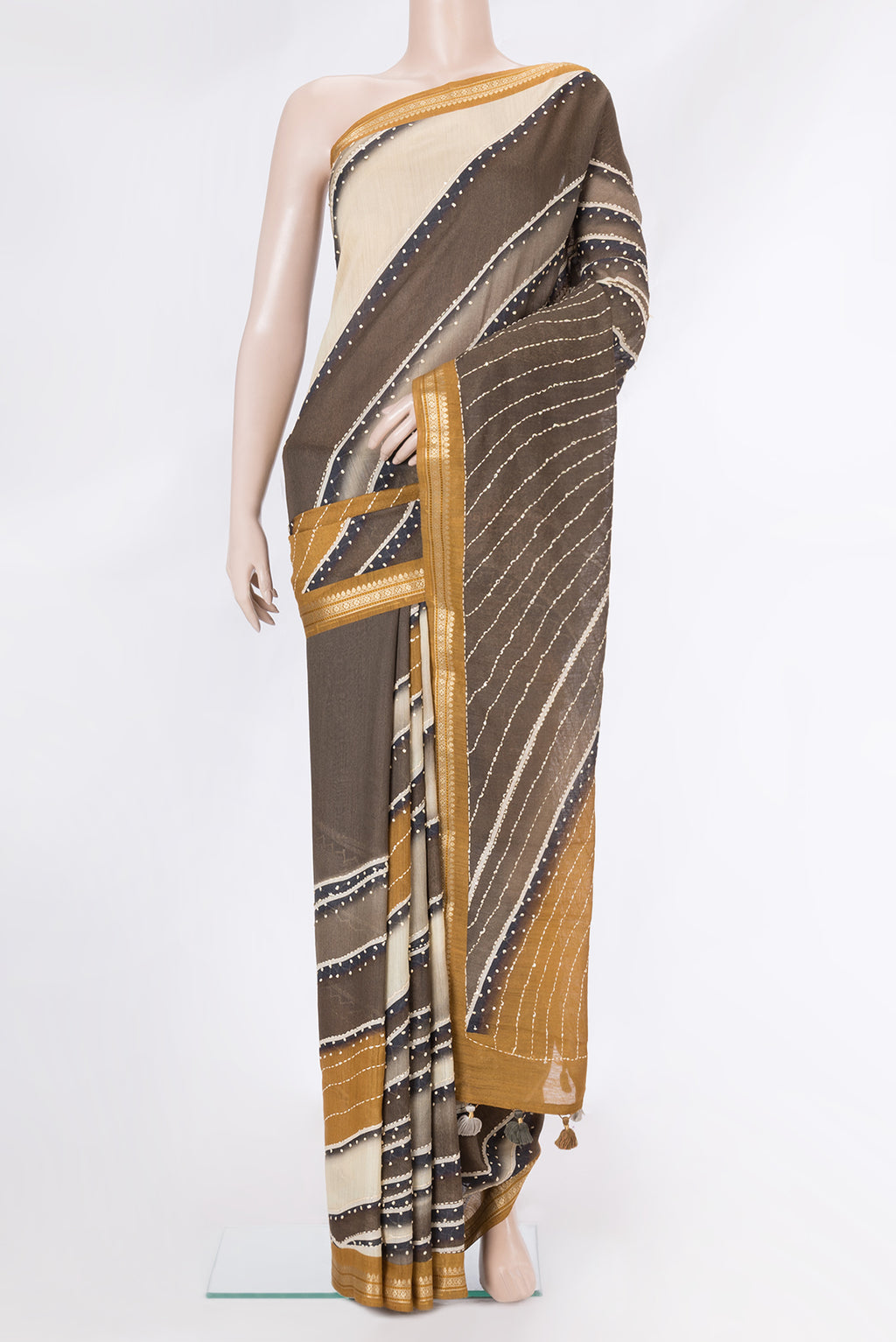 Brown Dual Tone Tussar Silk Saree with Embroidery on the body and Zari Border.  displayed on a mannequin