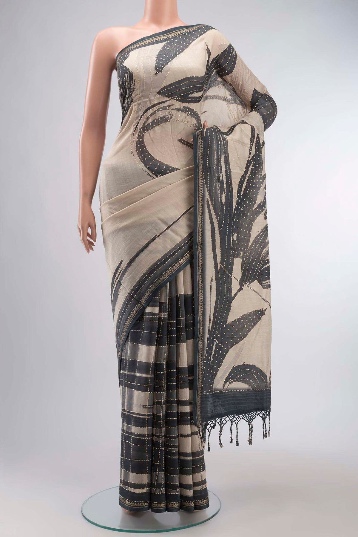 Beige Bhagalpuri Tussar Silk Saree with Embroidery on the body and Zari Border displayed on a mannequin