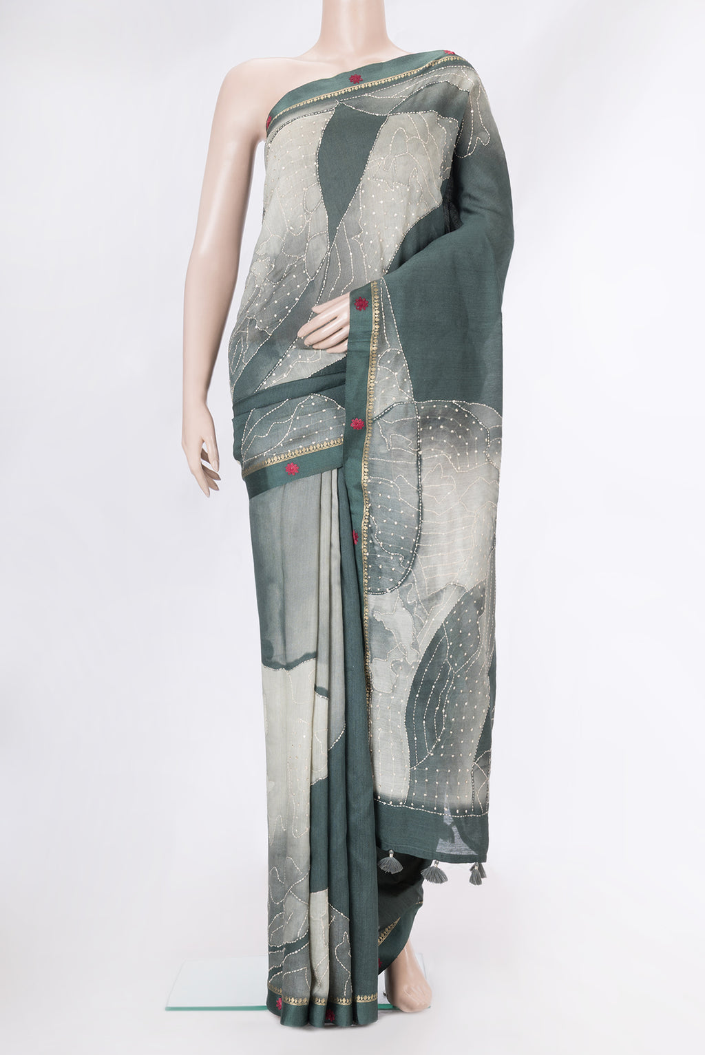 Grey Tussar Silk Saree with Embroidery on the body and Embroidery Border.  displayed on a mannequin