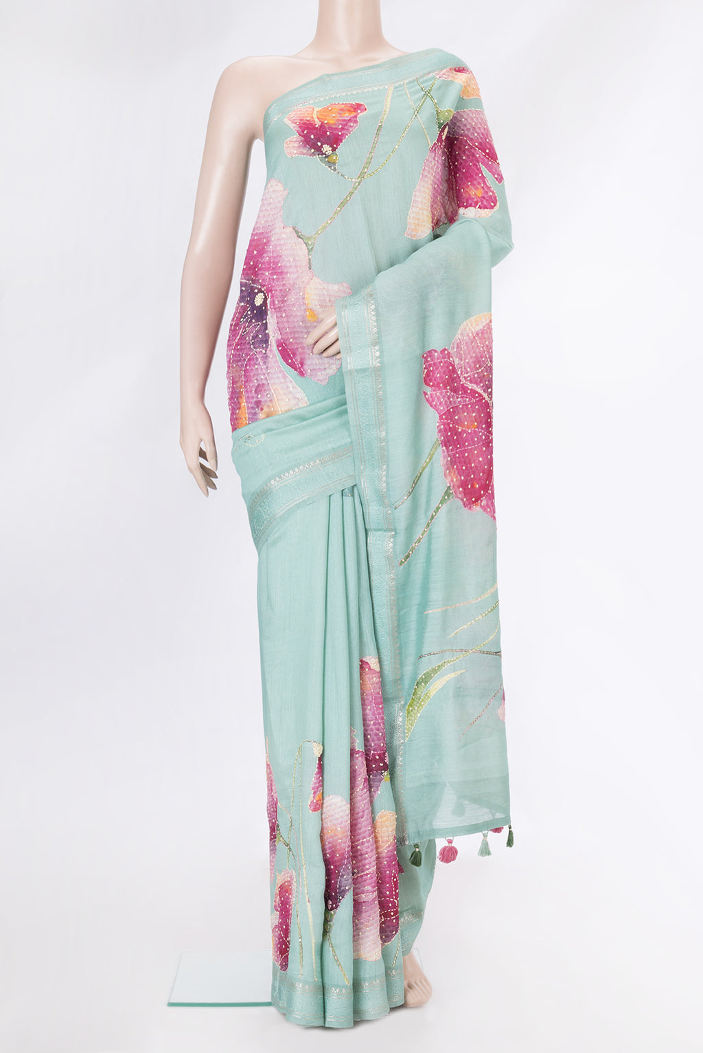Sea Green Dual Tone Tussar Silk Saree with Embroidery on the body and Zari Border.  displayed on a mannequin