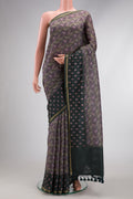 Purple Dual Tone Tussar Silk Saree with Printed design on the body and Embroidery Border.  displayed on a mannequin