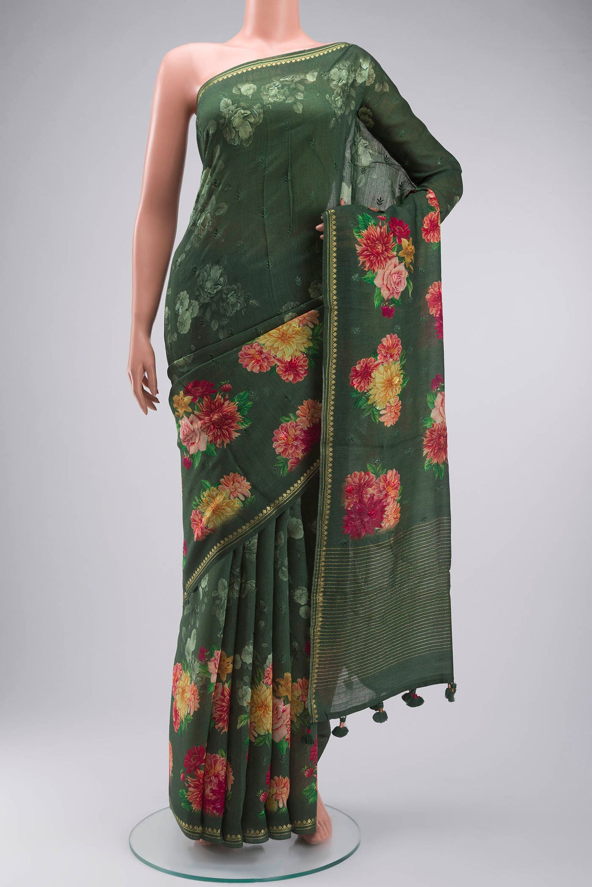 Green Tussar Silk Saree with Thread Butta on the body and Zari Border displayed on a mannequin